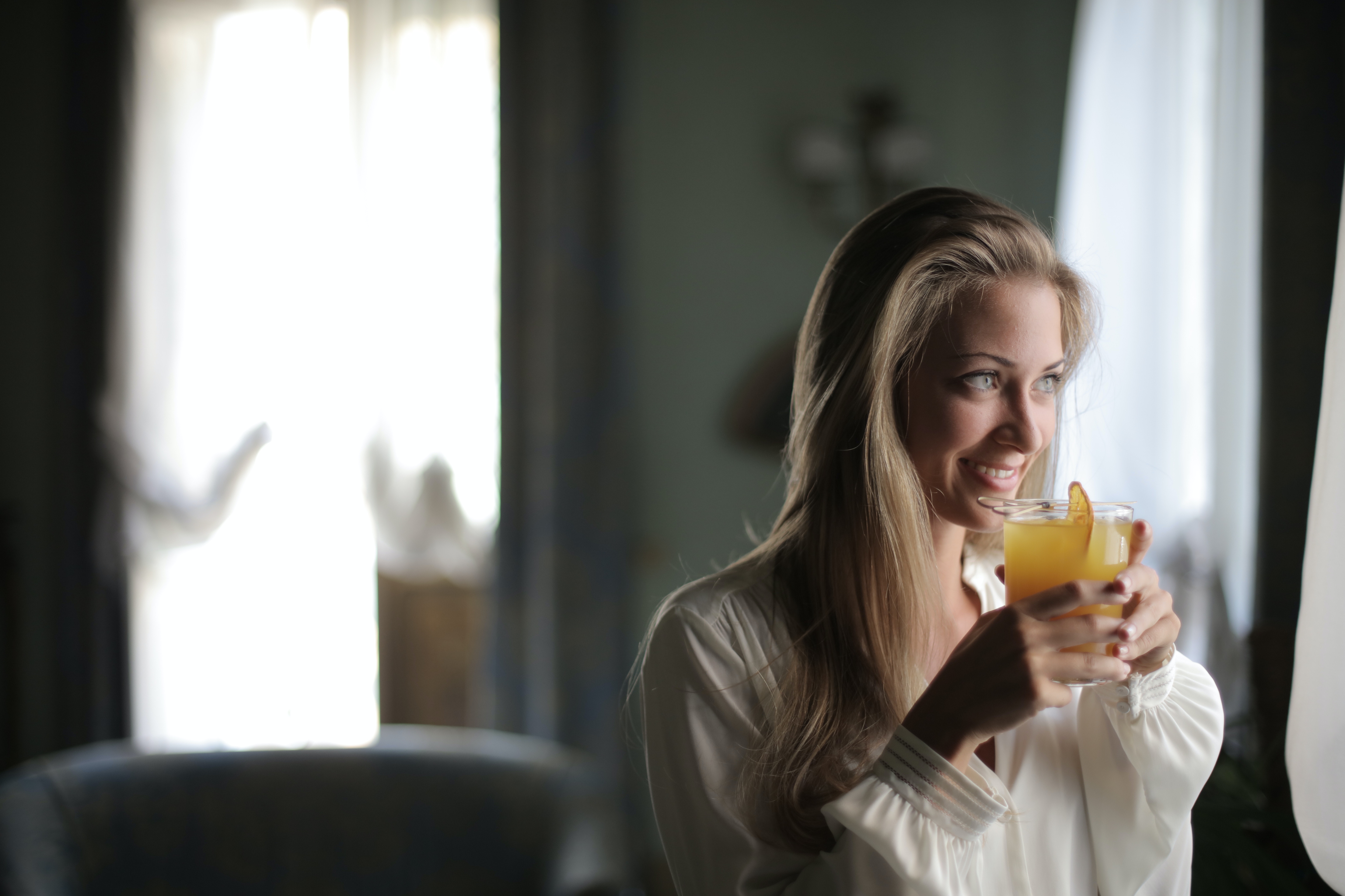 Woman Holding Drinking Glass With Juice · Free