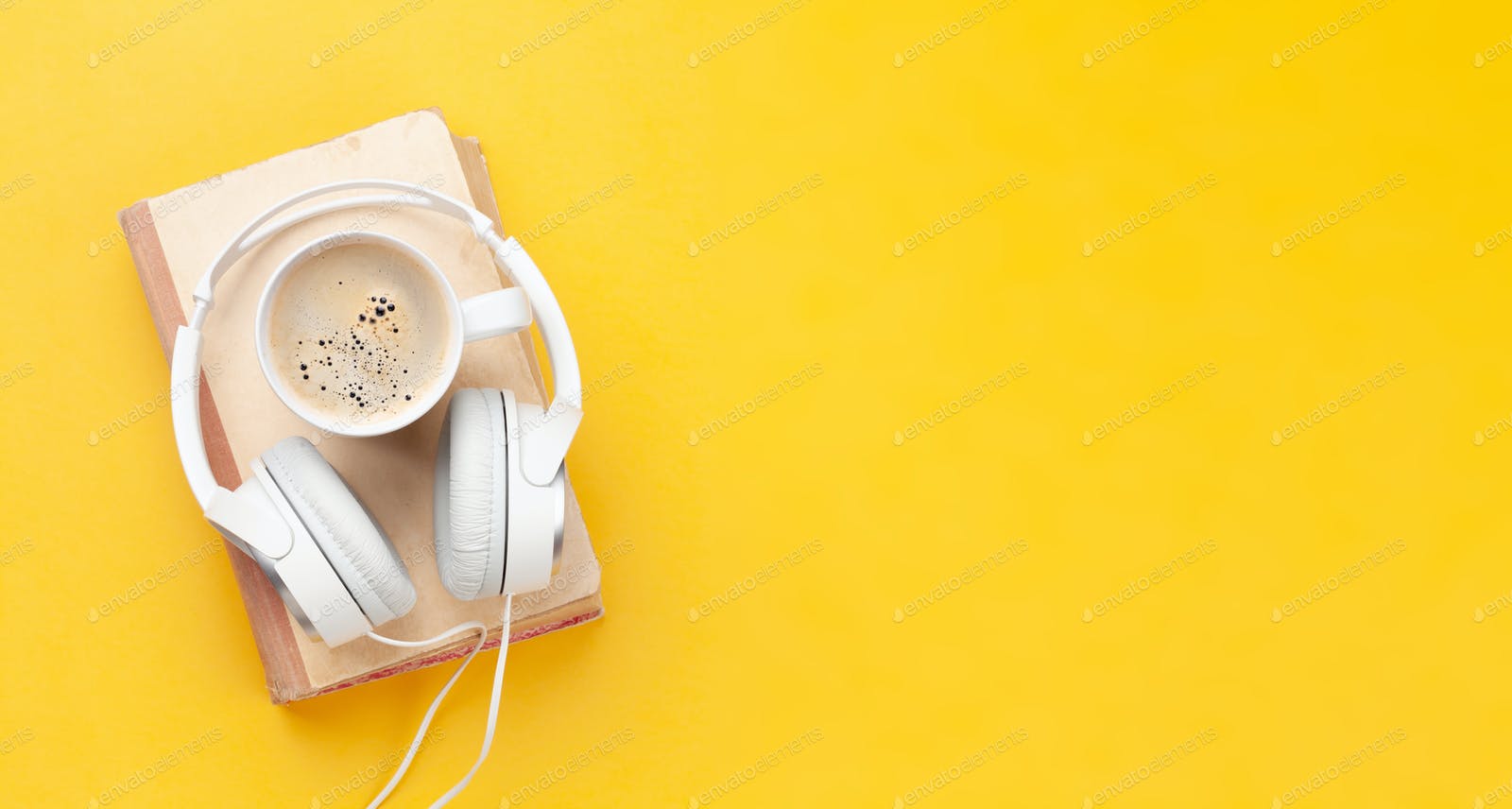 Coffee cup, book and headphones photo by karandaev on Envato Elements