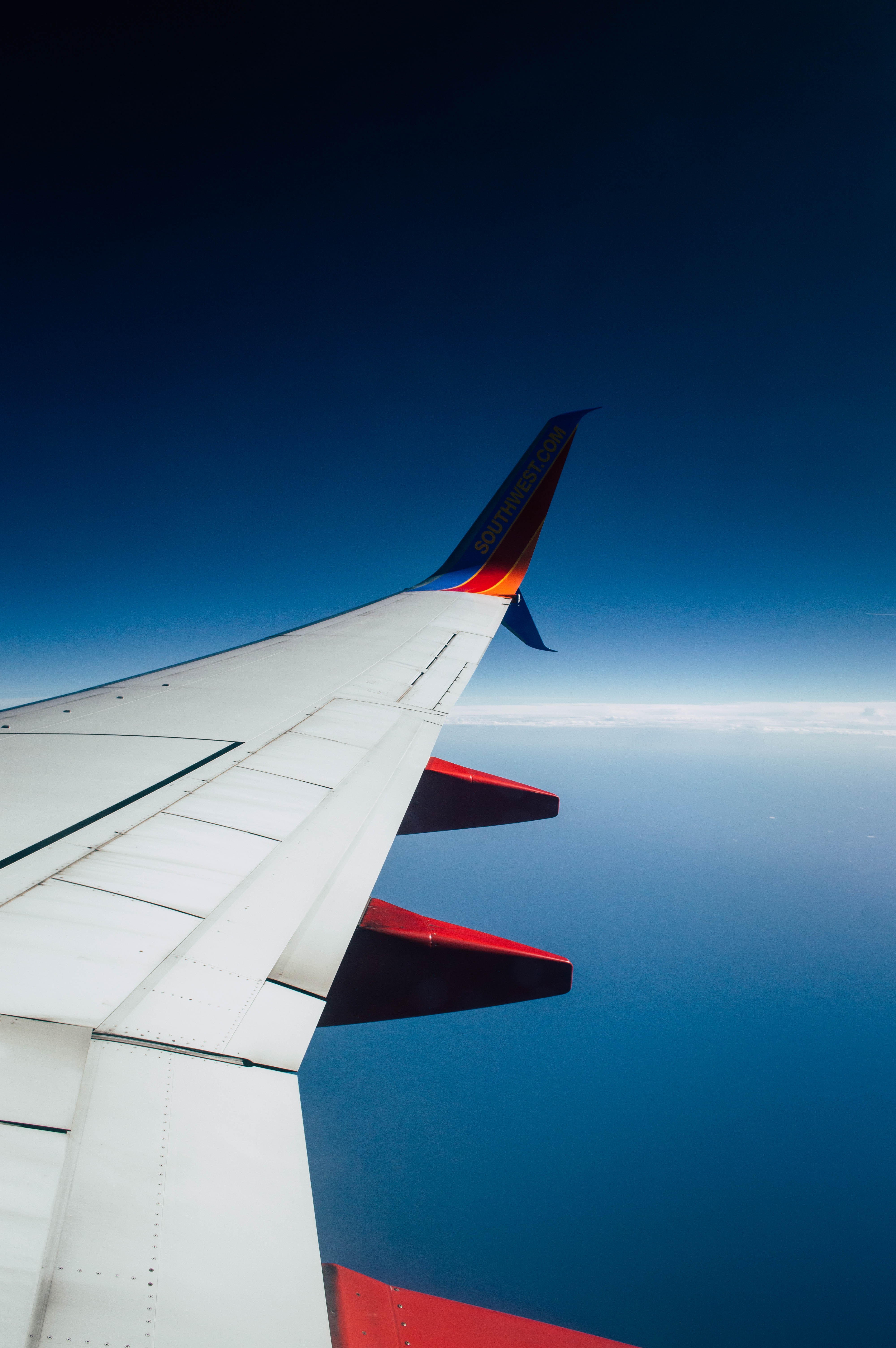 Aerial Photography of White Airplane Wing Above White Clouds · Free