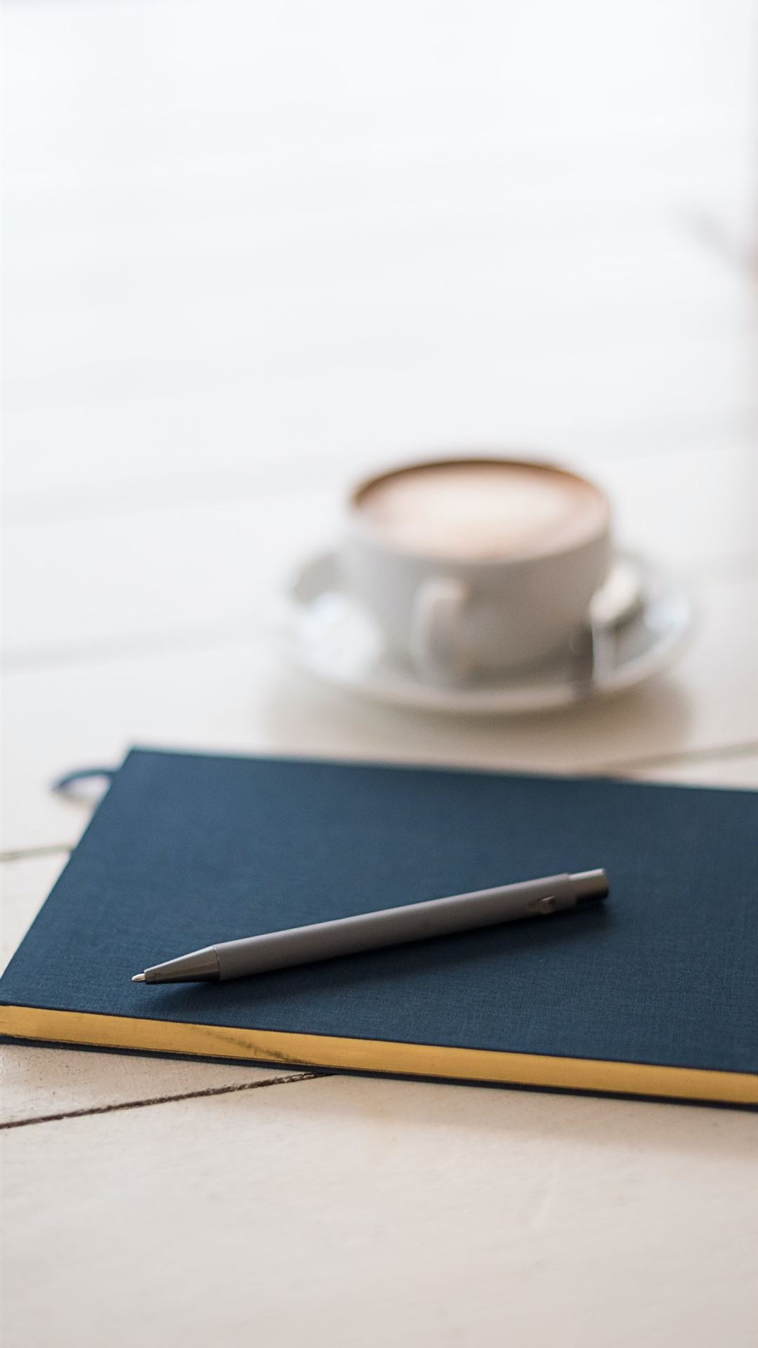 selective focus photography of black pen on book iPhone Wallpaper Free Download