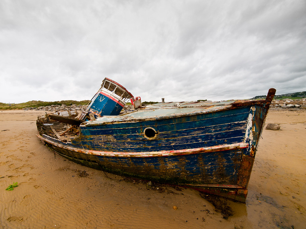 Abandoned Boat. Abandoned and rotting boat on the estuary f