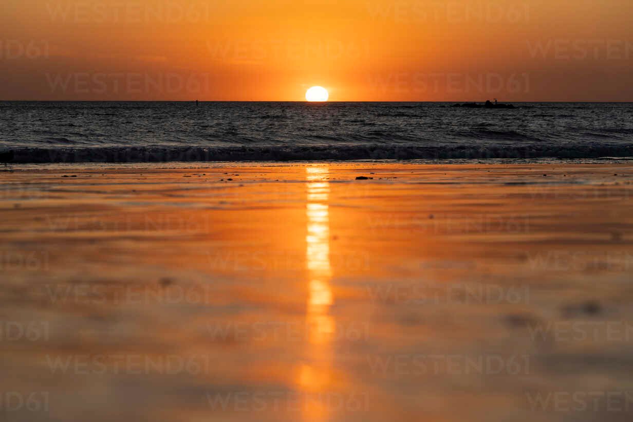 USA, California, Santa Monica, Surface view of sandy coastal beach at sunset with clear line of