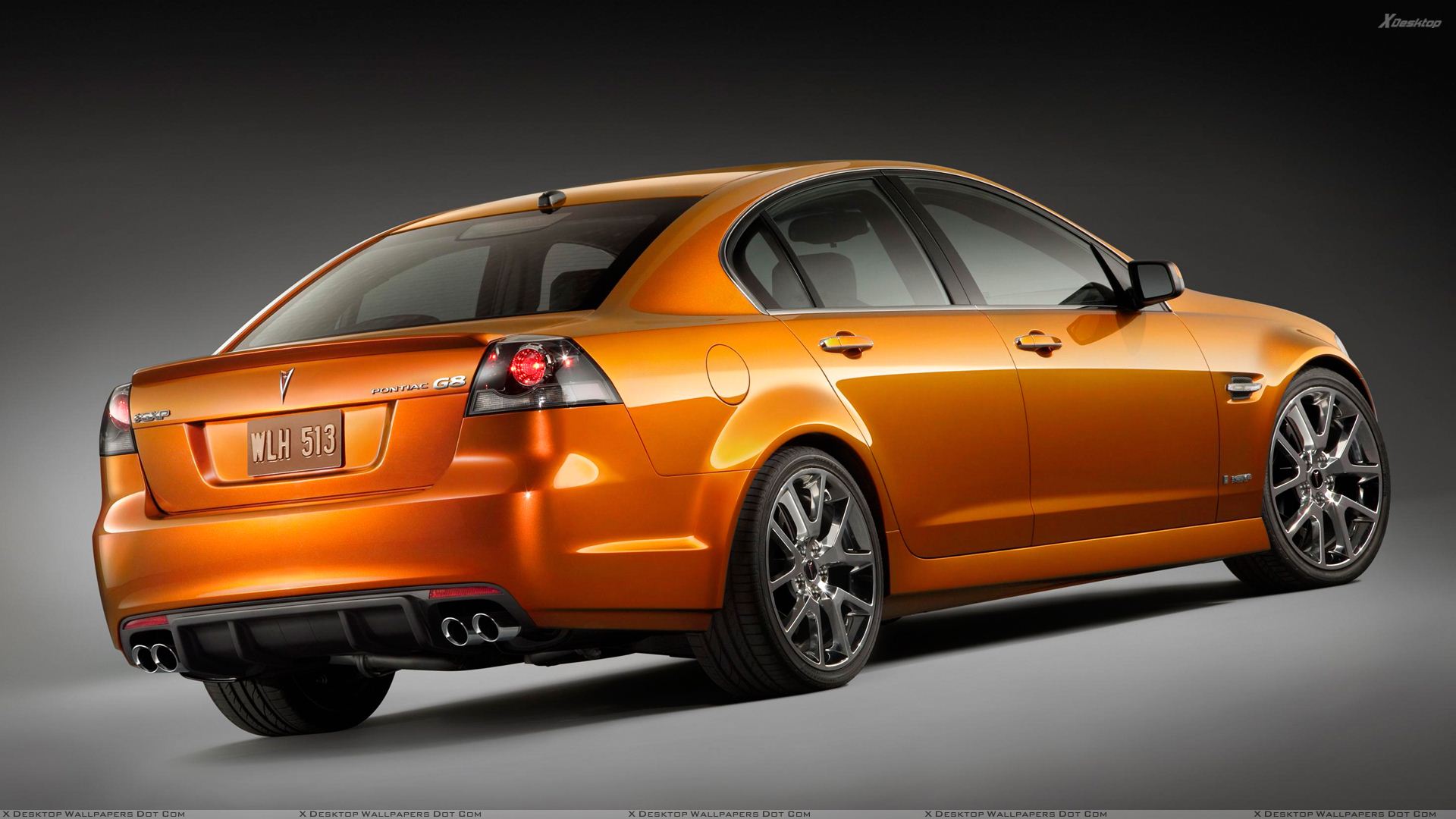 Pontiac G8 In Orange Back Side Pose Wallpaper