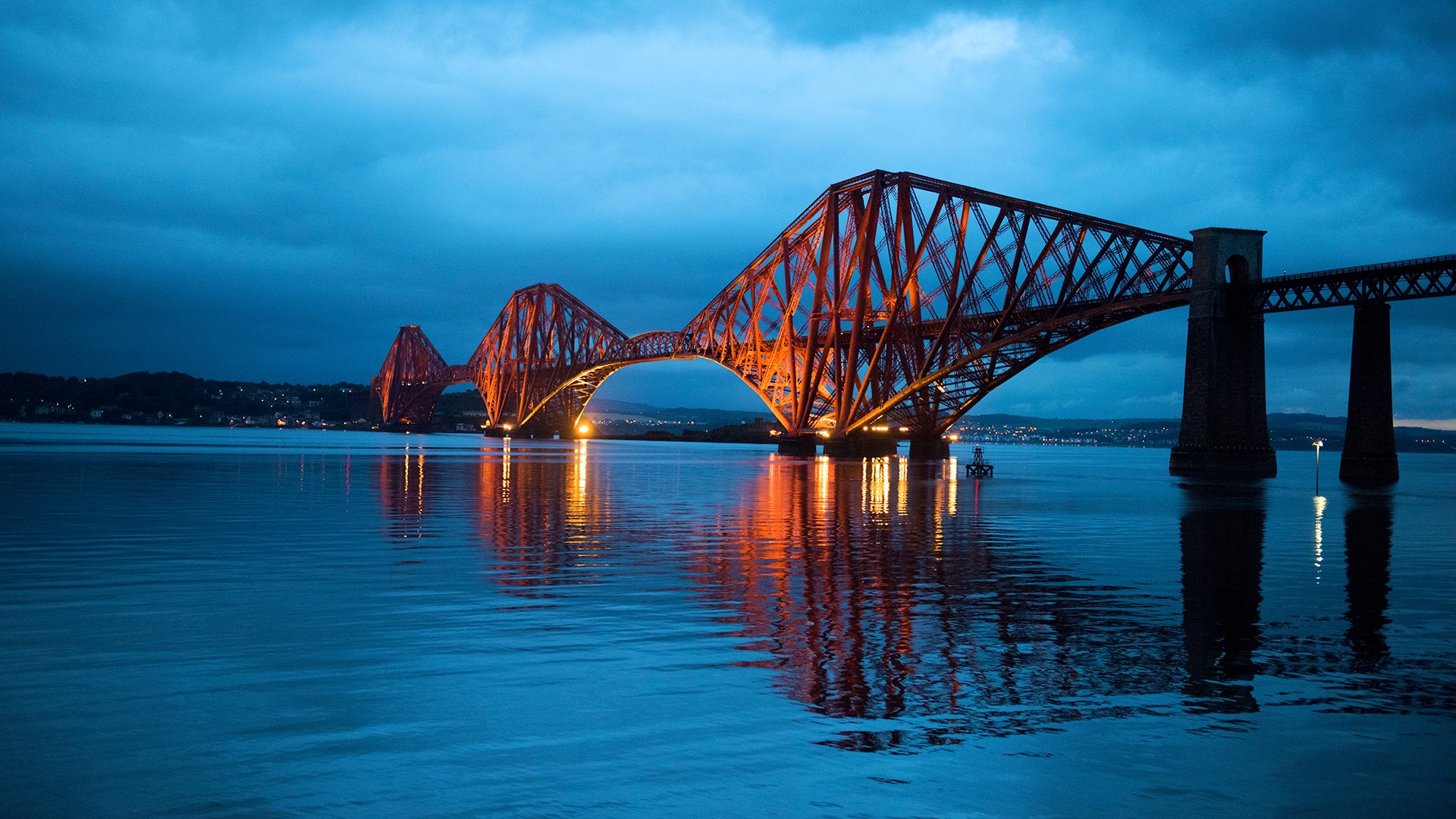 Night view at Forth Bridge across the Firth of Forth, South Queensferry, Scotland, UK. Windows 10 Spotlight Image