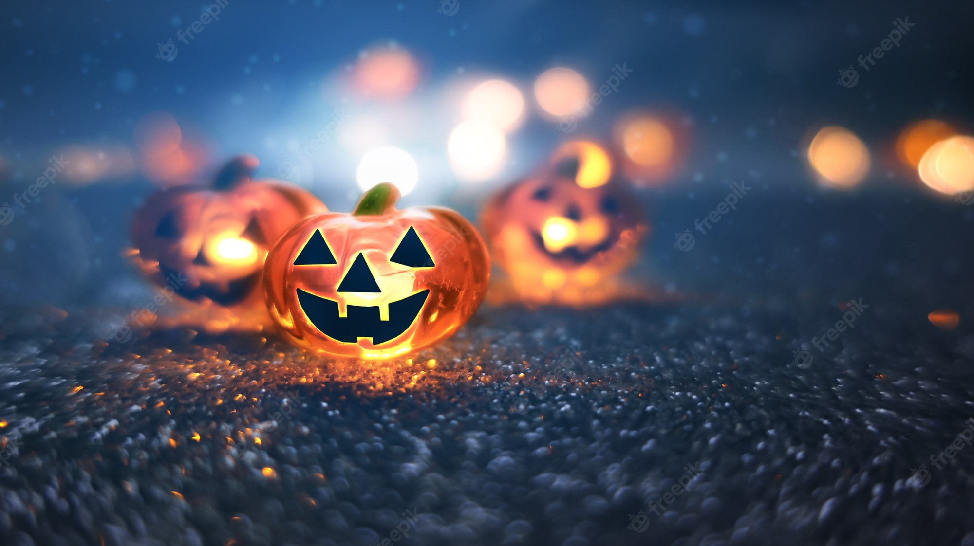 Premium Photo. Neon glowing pumpkin head on abstract blurred bokeh background. festive halloween background with cobwebs and pumpkin