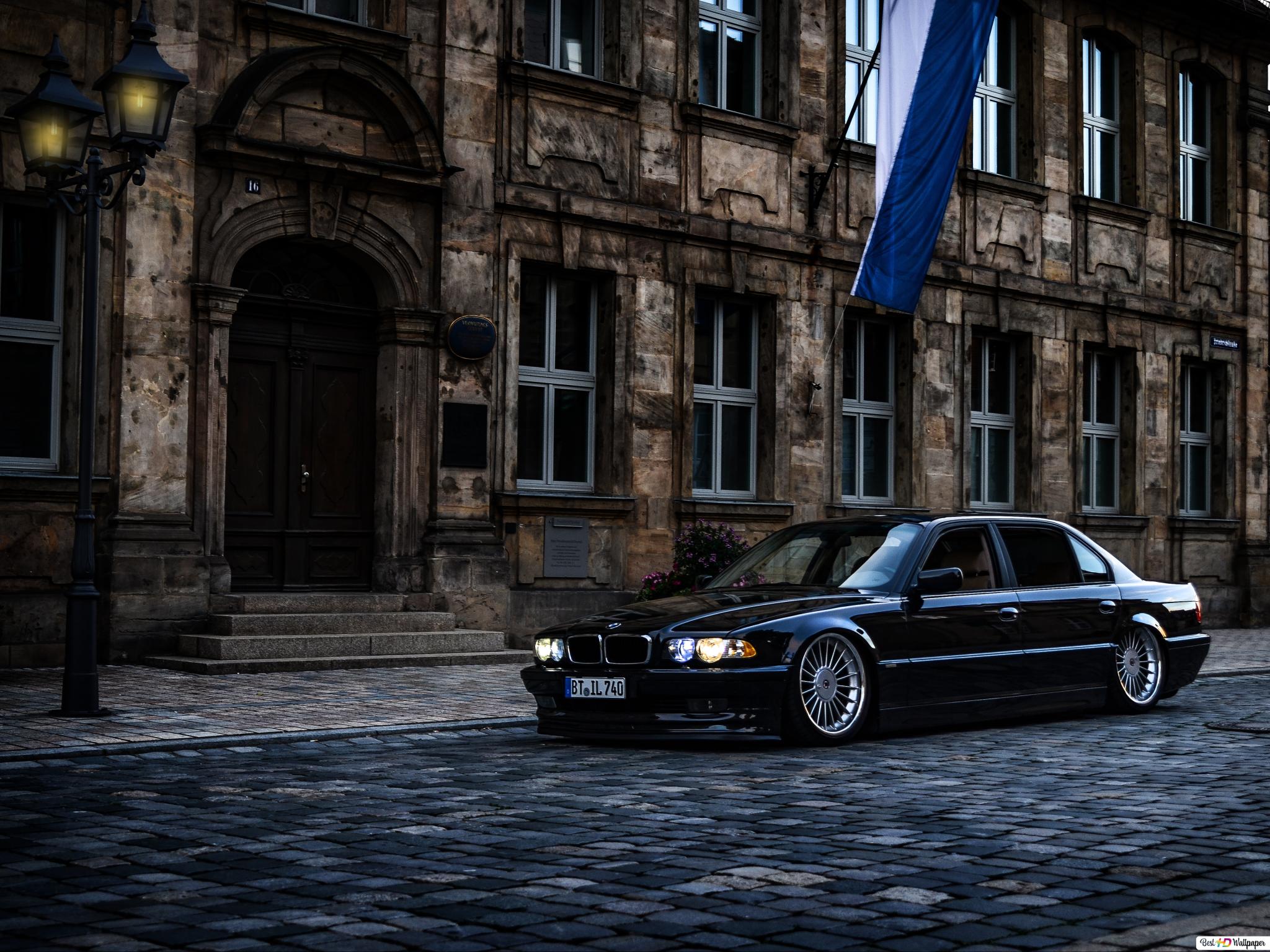 Black BMW sedan parked near house HD wallpaper download