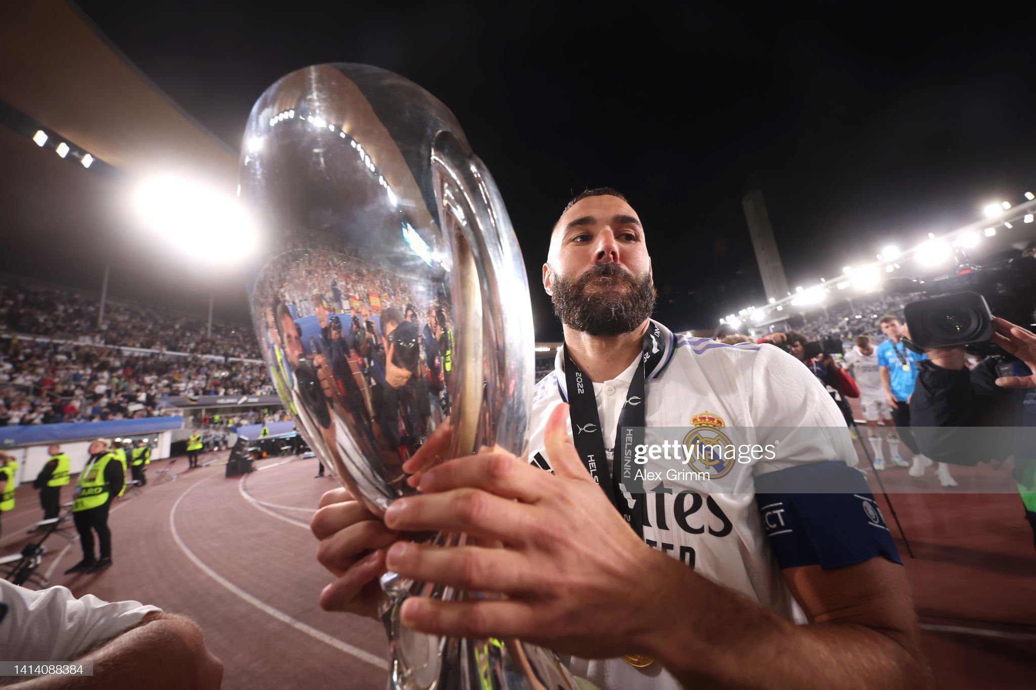 Karim Benzema of Real Madrid celebrates the UEFA Super Cup trophy. News Photo