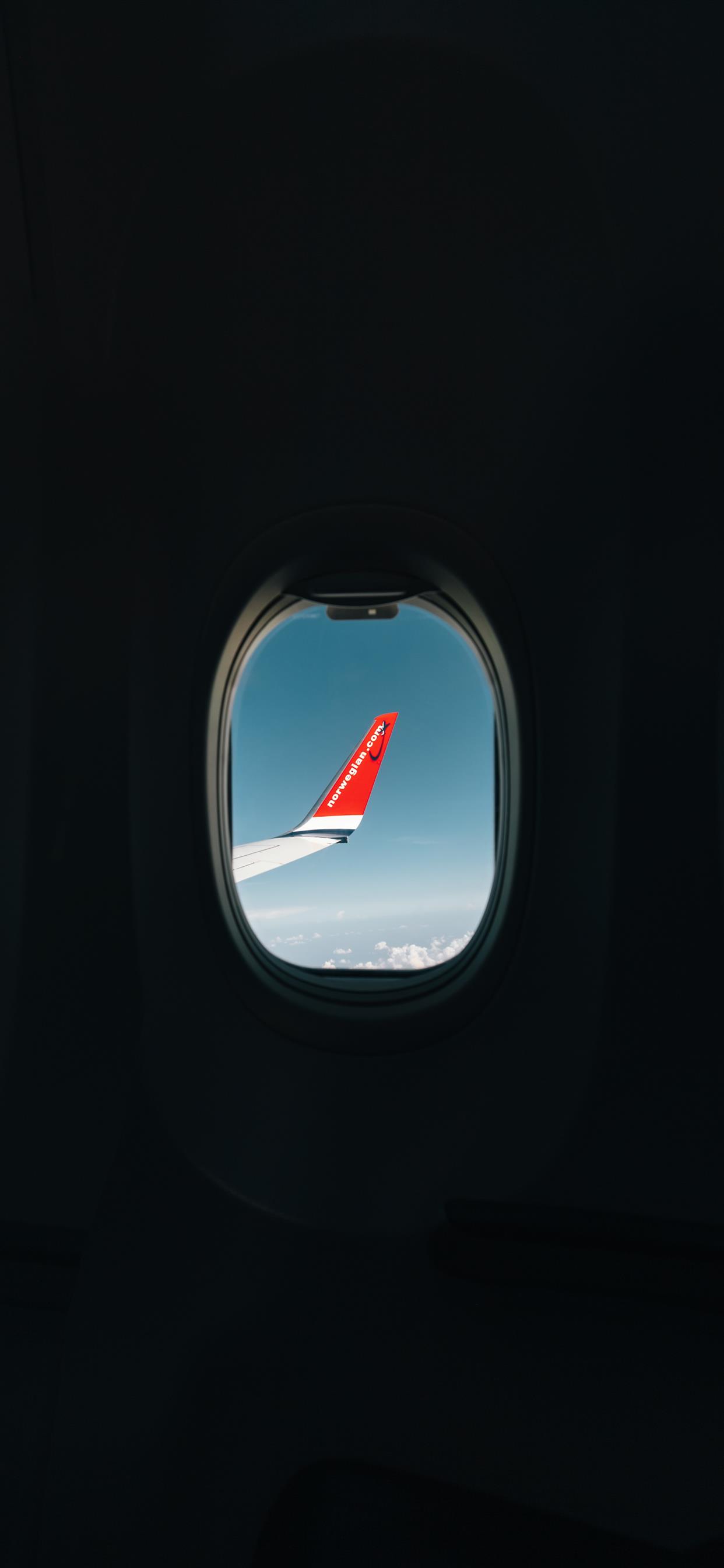red airplane wing through window iPhone X Wallpaper Free Download