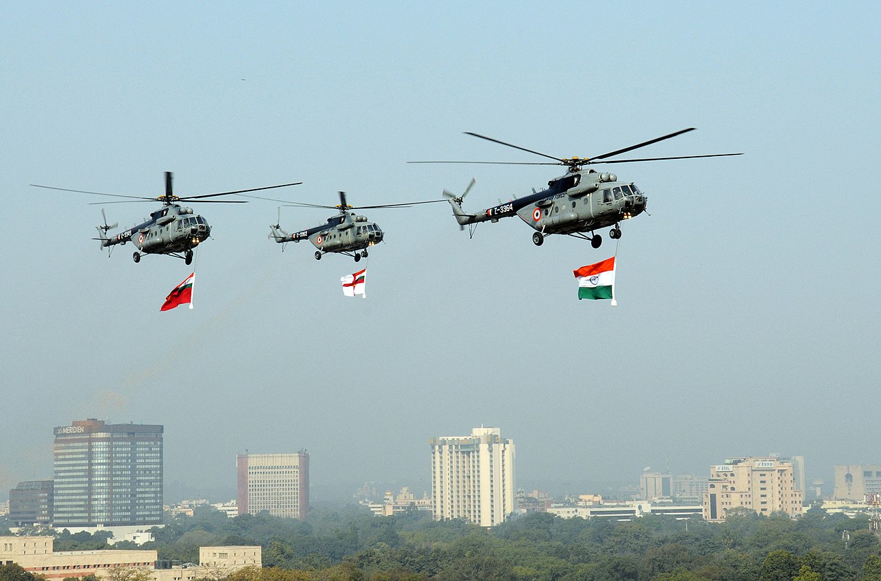 The IAF Helicopters carrying the tricolour and services flag, during the 62nd Republic Day Parade- at Rajpath, in New Delhi on January