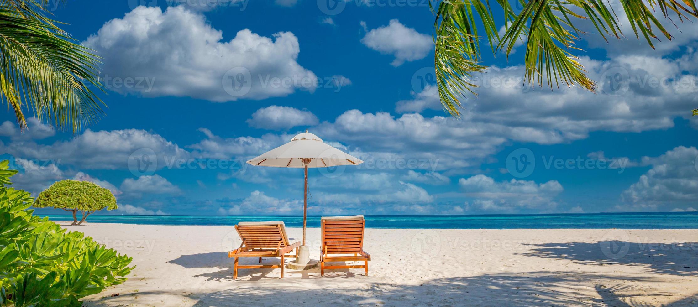 Tranquil beach scene, couple chairs, umbrella. Exotic tropical beach landscape destination for background or wallpaper. Design of romantic summer vacation holiday concept