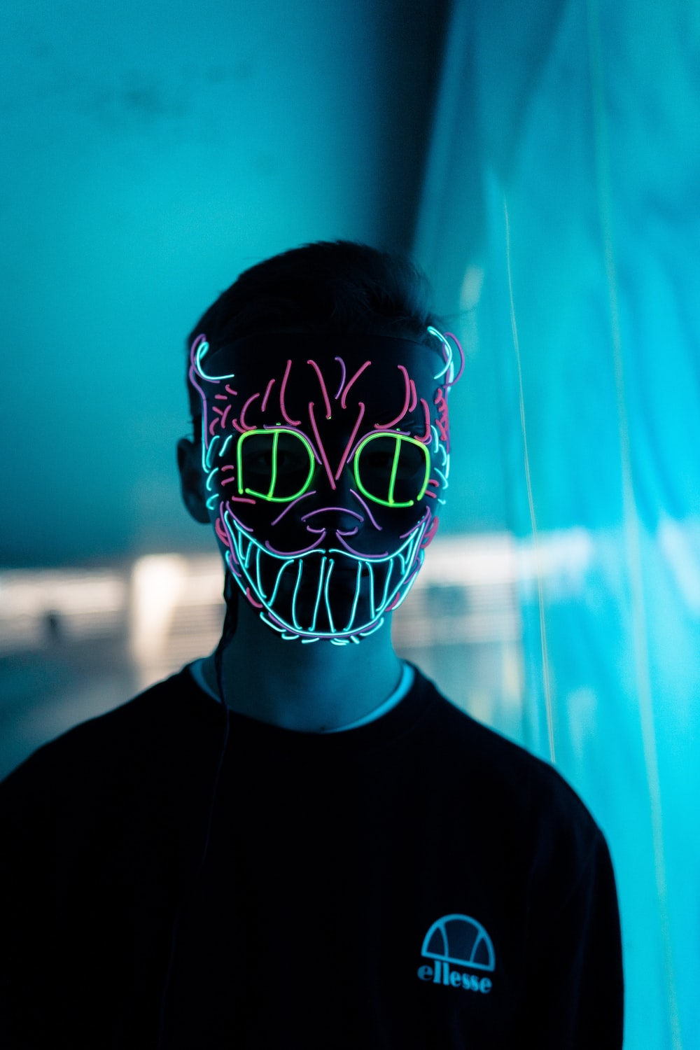man wearing cat neon light mask photo