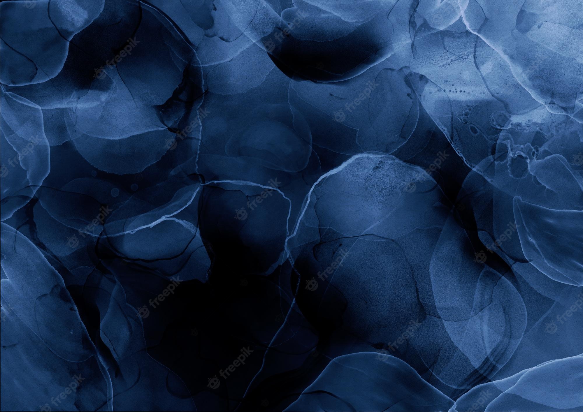 Free Photo. Blue liquid ink texture on a black background