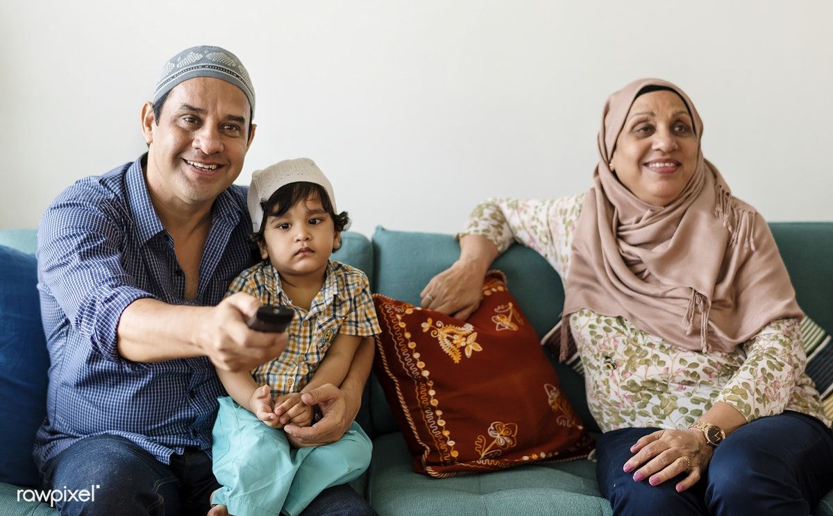 Download premium image of Muslim family relaxing in the home by Chanikarn Thongsupa about muslim family at home, at home, cap, covered, and cultural 425705