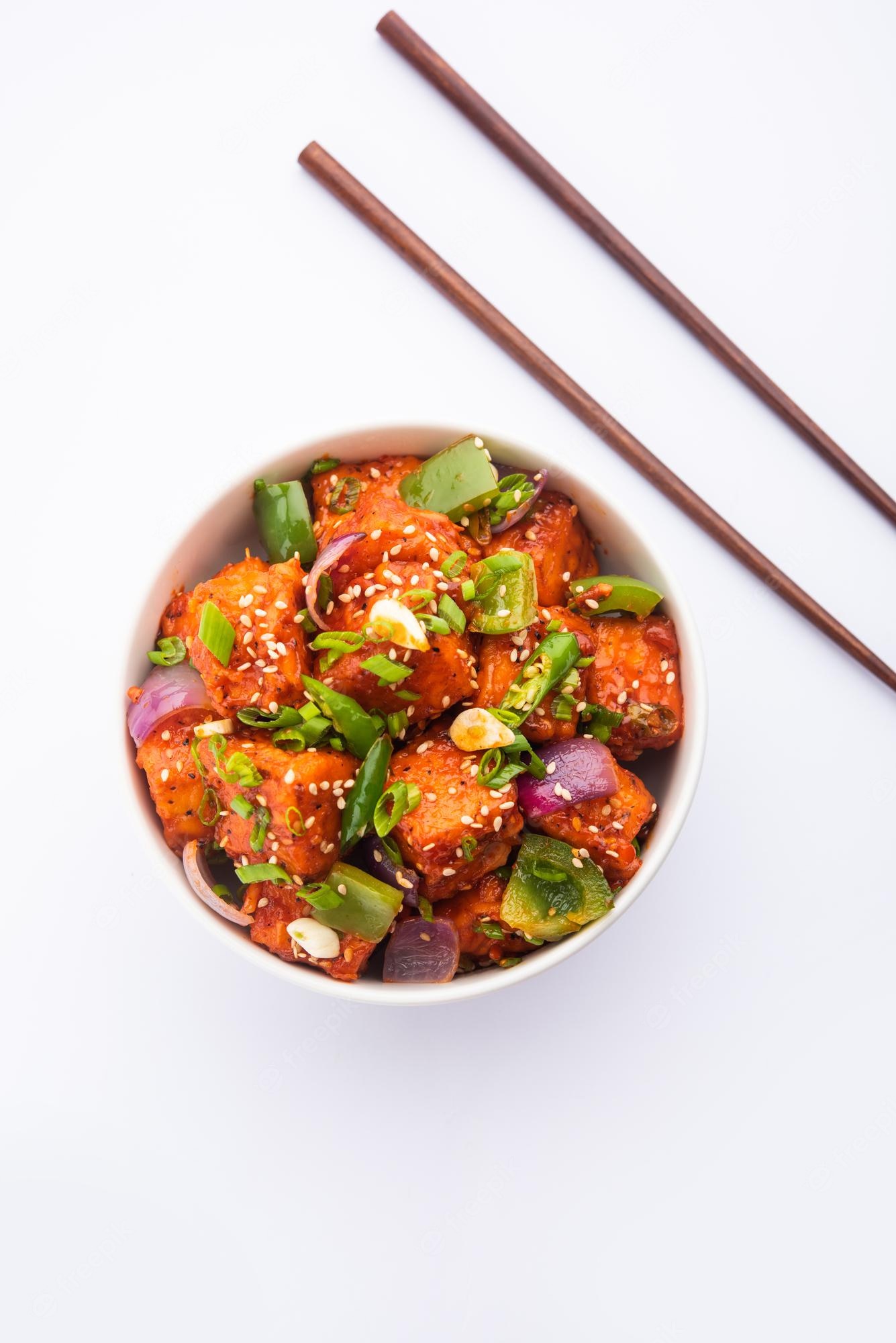 Premium Photo. Chilli paneer dry is made using cottage cheese, indo chinese food