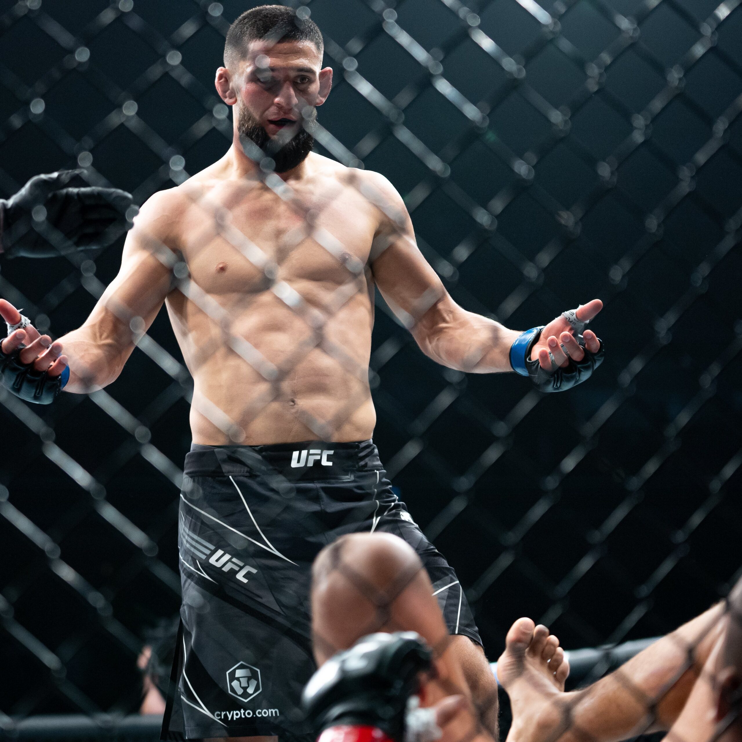 Khamzat Chimaev Breaks the Internet as Photo of Him Sitting on Top of the Cage Go Viral