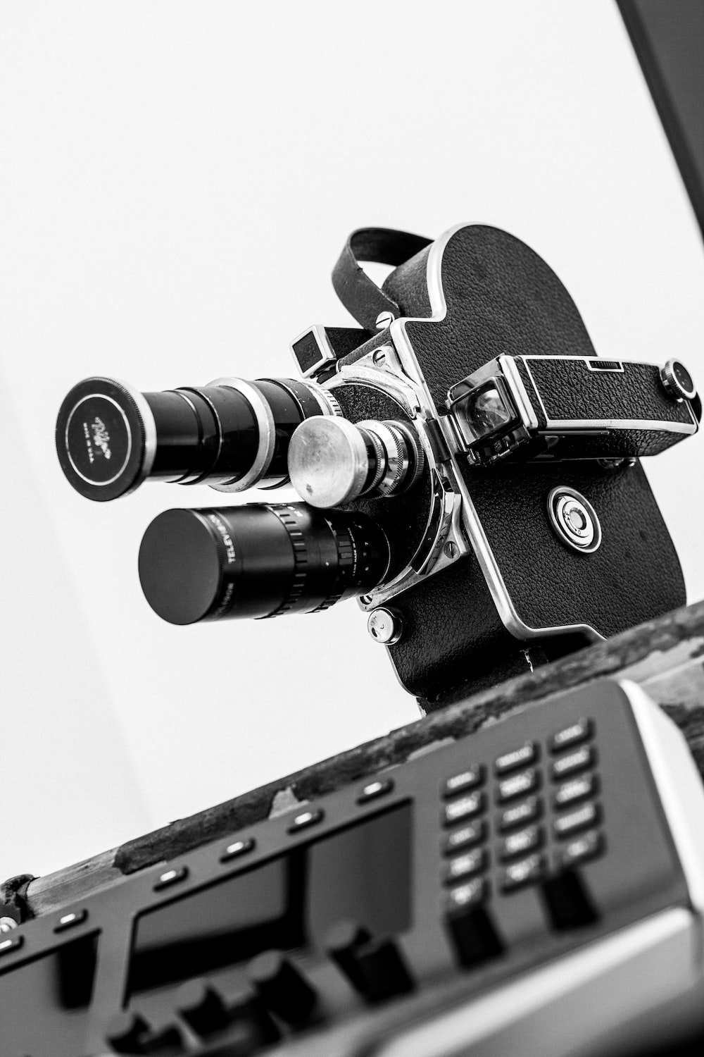 black and silver dslr camera on black and white surface photo