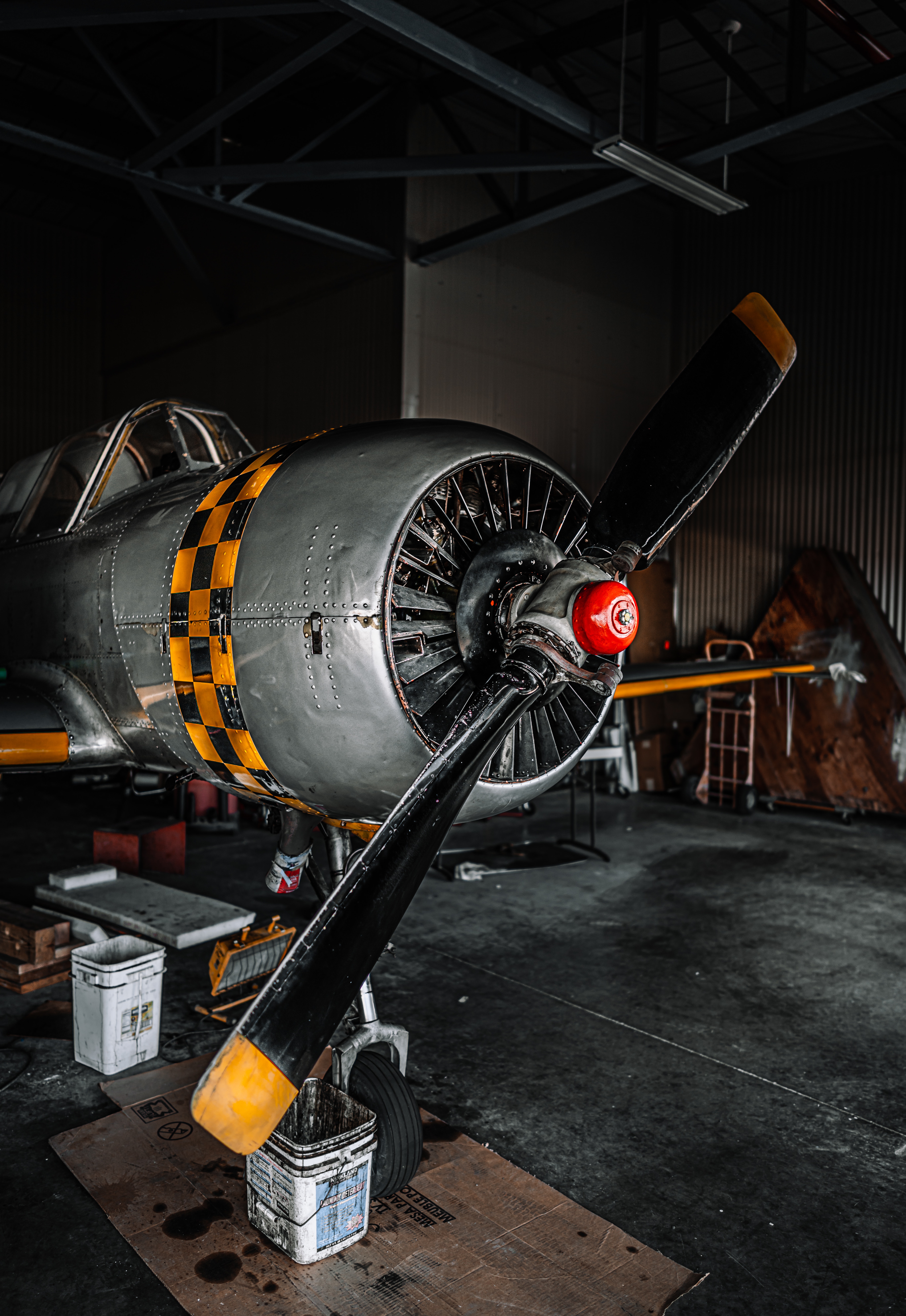 Fixed wing airplane parked in hangar for repairing · Free
