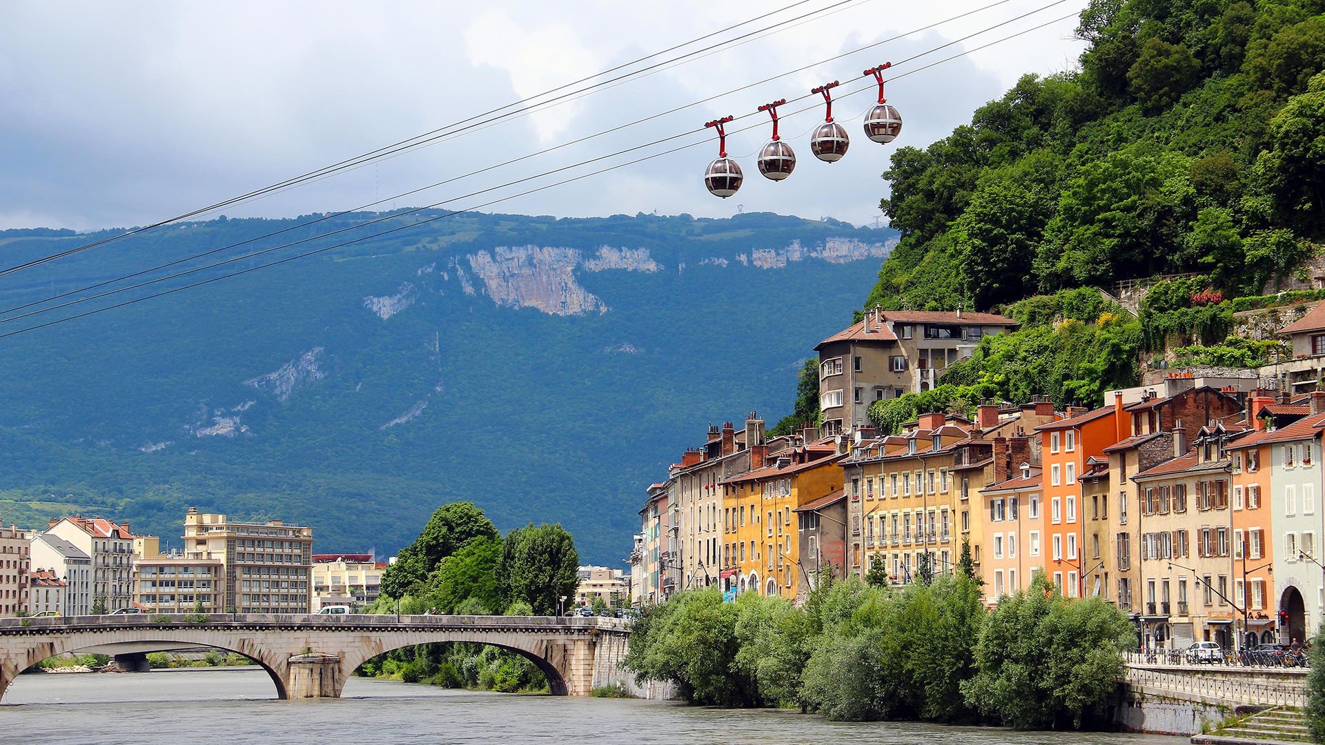 Isere river and cable car in the center of Grenoble, France. Windows 10 Spotlight Image
