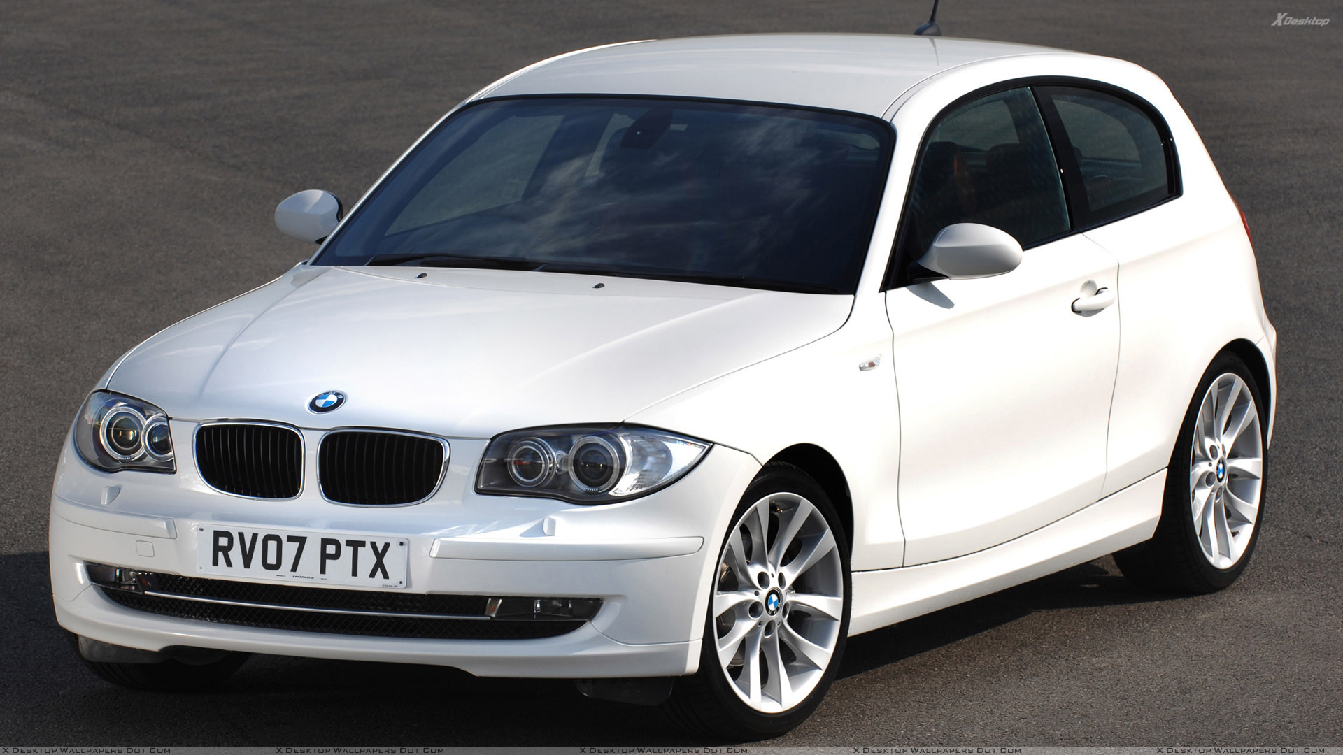 Front Pose Of BMW 1 Series 3 Door In White Wallpaper