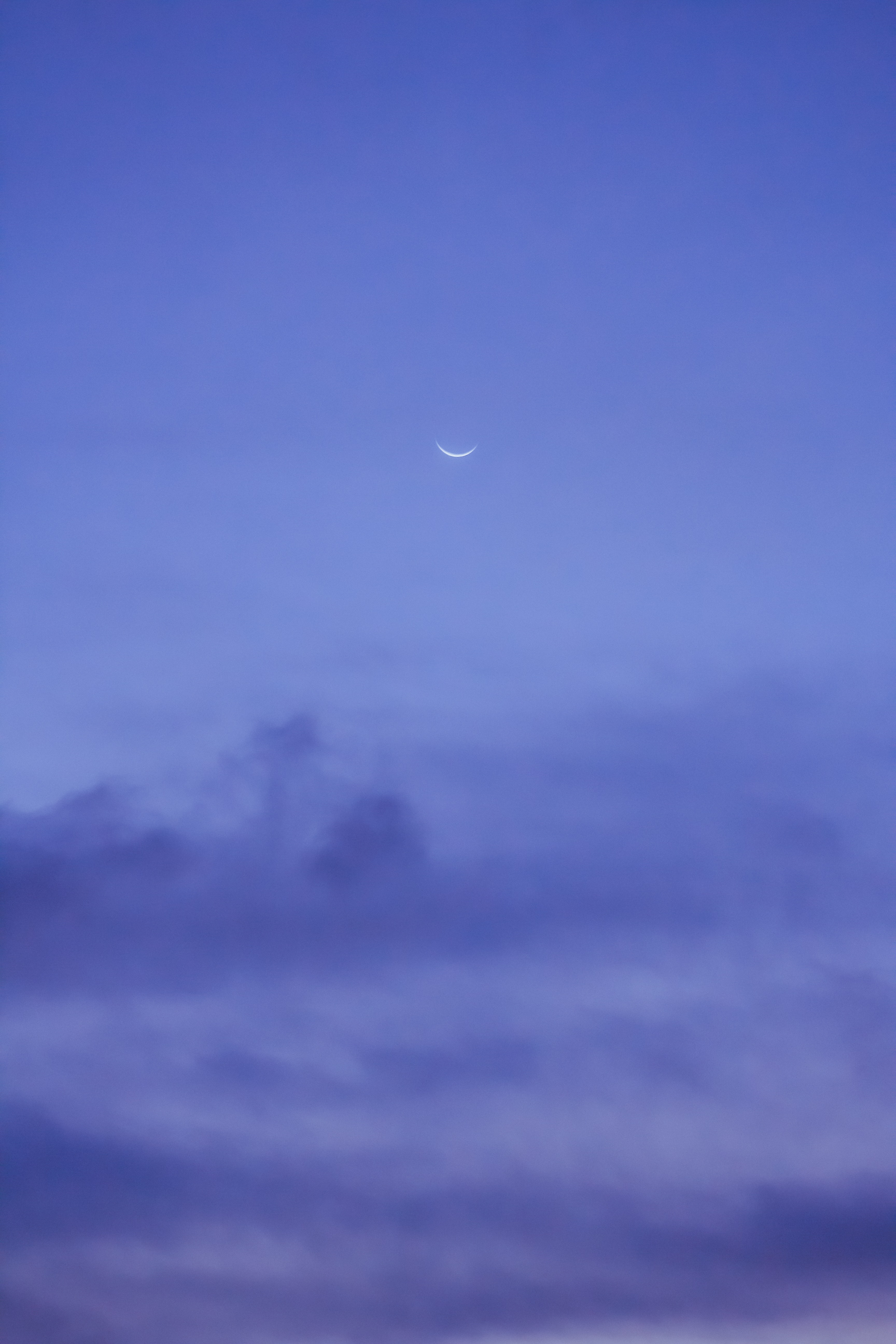 Half moon against dark blue sky at night · Free