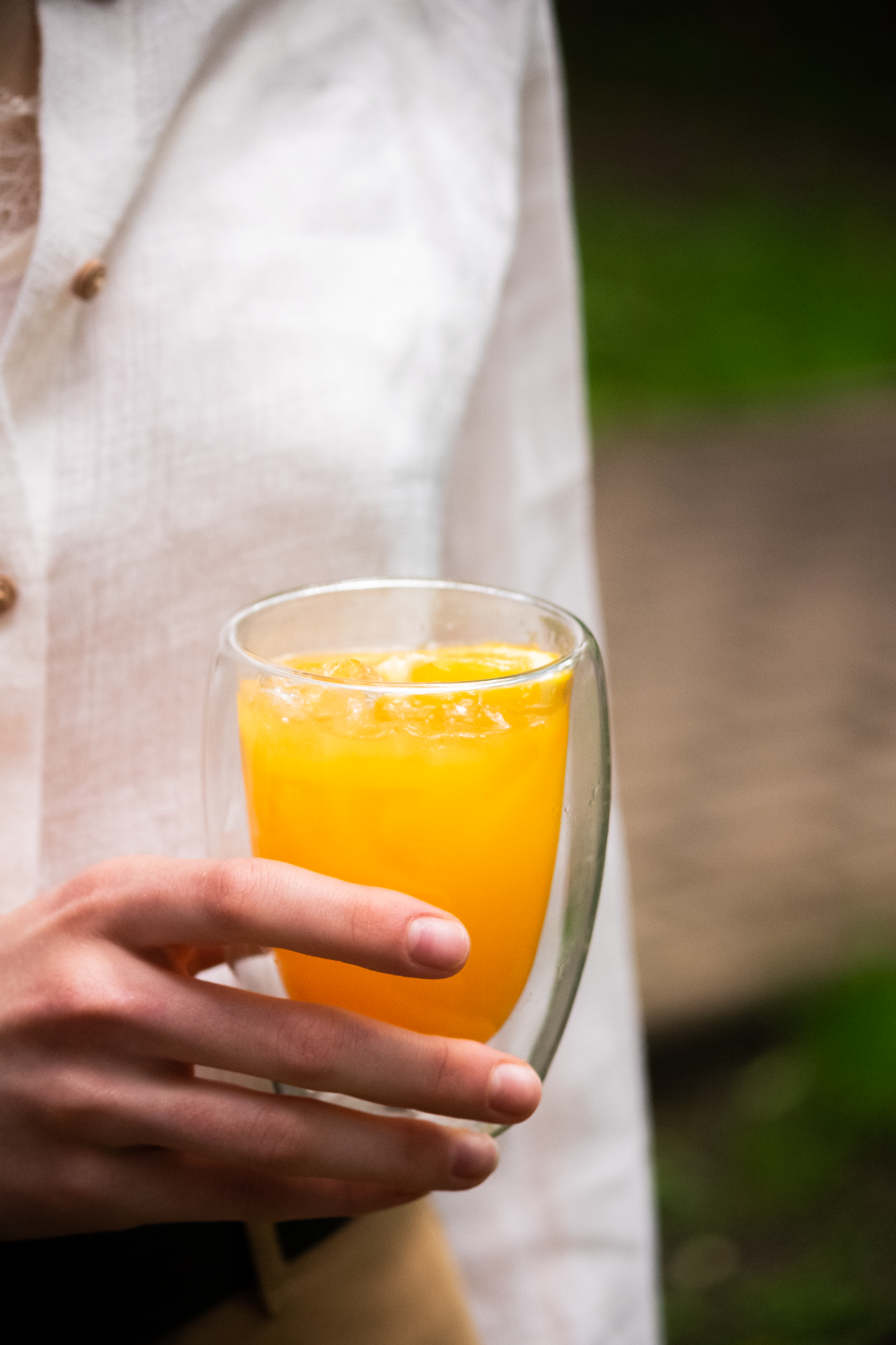 Woman Holding a Glass with Orange Juice · Free
