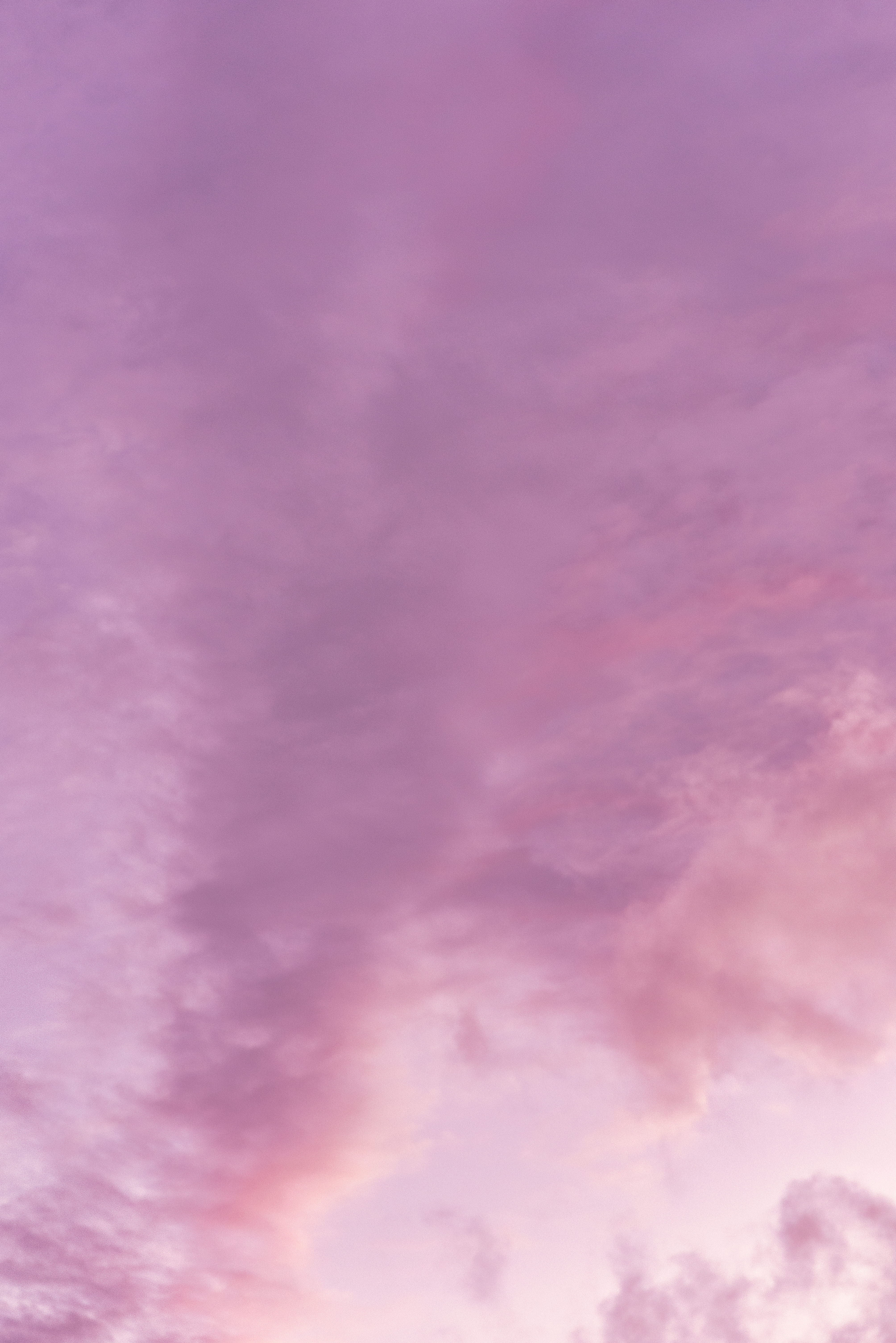 Purple sundown sky with fluffy clouds · Free