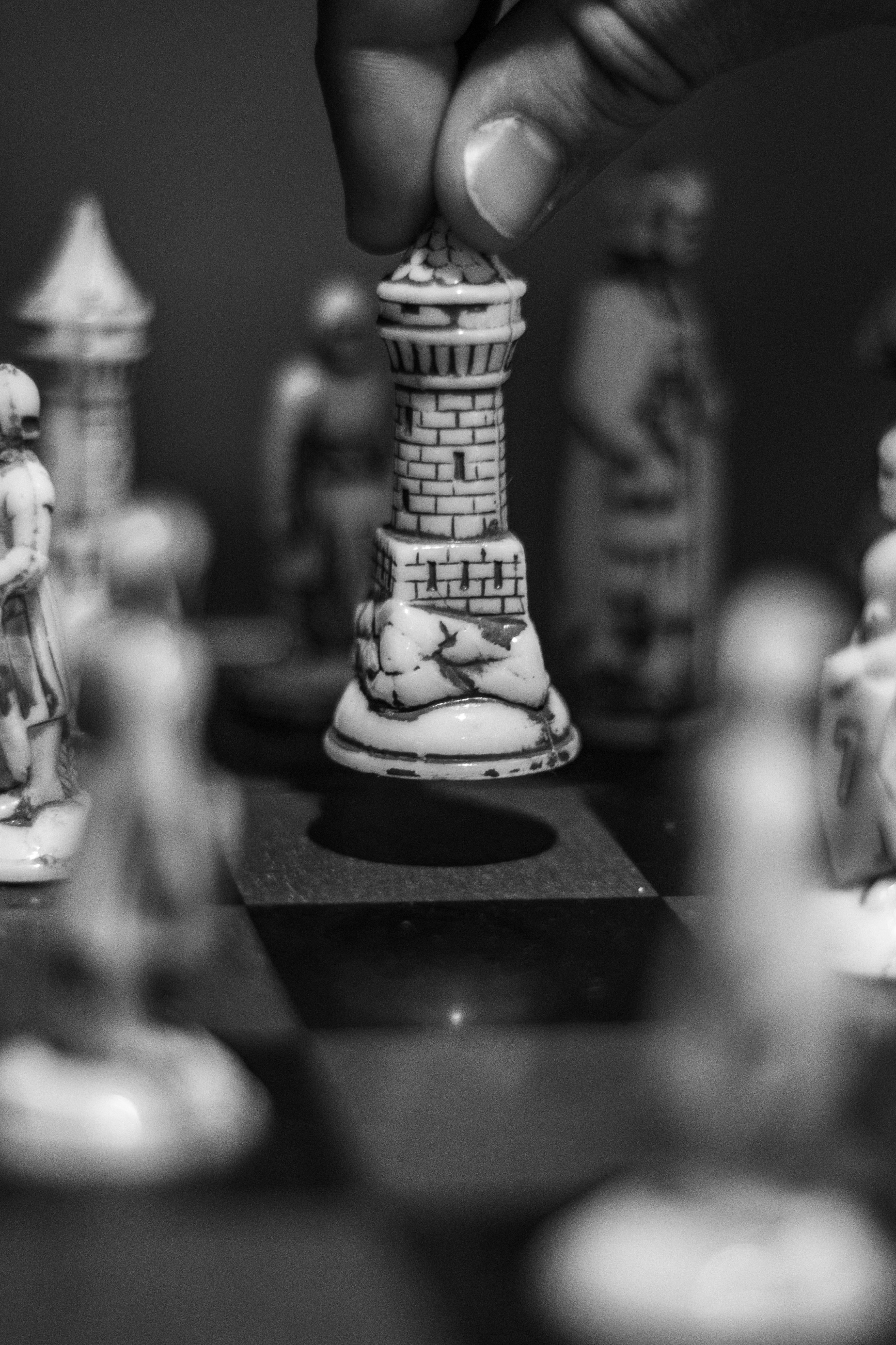 Gray scale Photo of Person Holding Chess Piece · Free