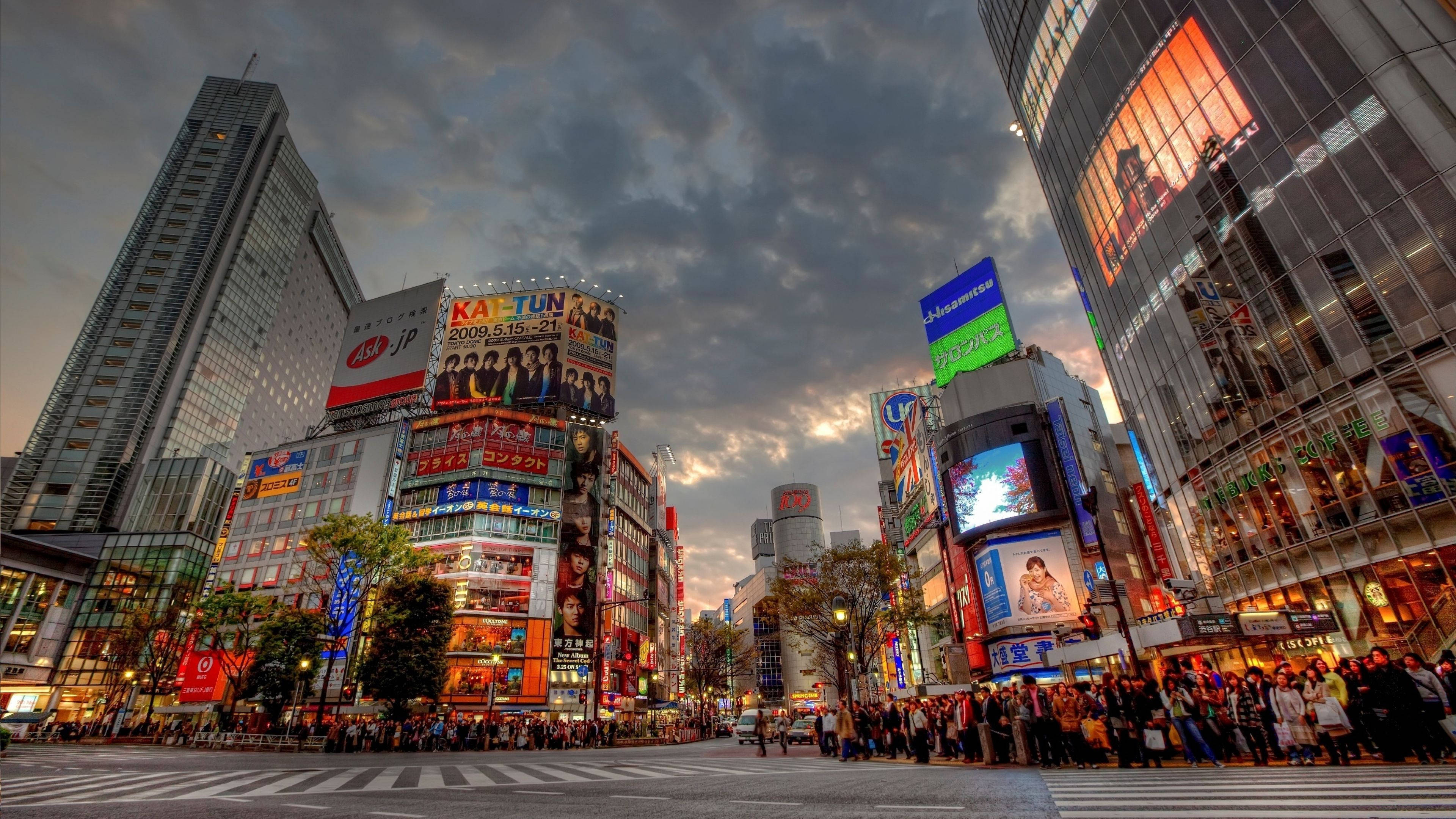 Download Shibuya Crossing In Tokyo At Sunset Wallpaper