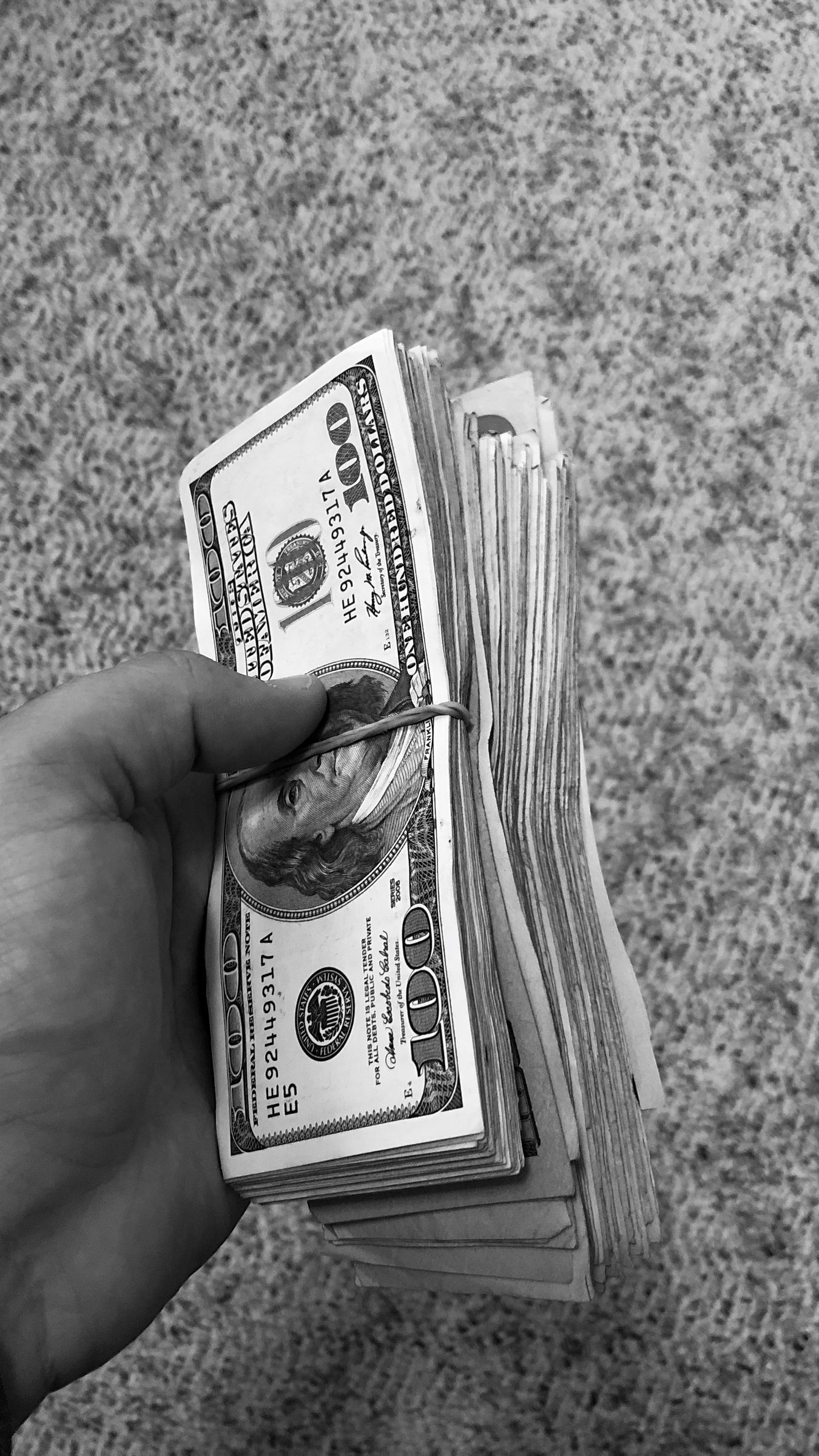 Download wallpaper 1350x2400 money, bills, bw, hand iphone 8+/7+/6s+/for parallax HD background