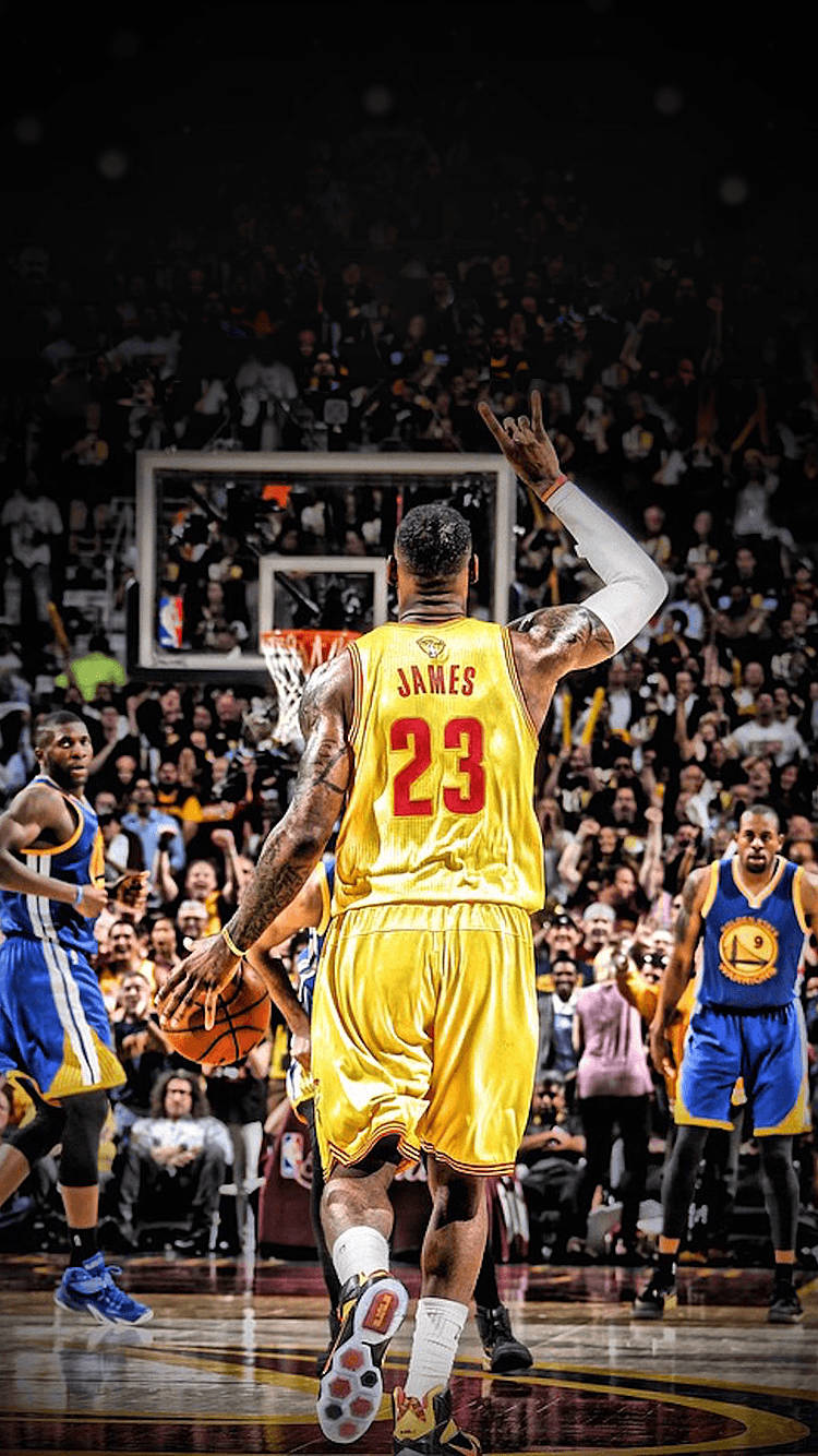 Download Lebron James showing off his iconic hand sign Wallpaper