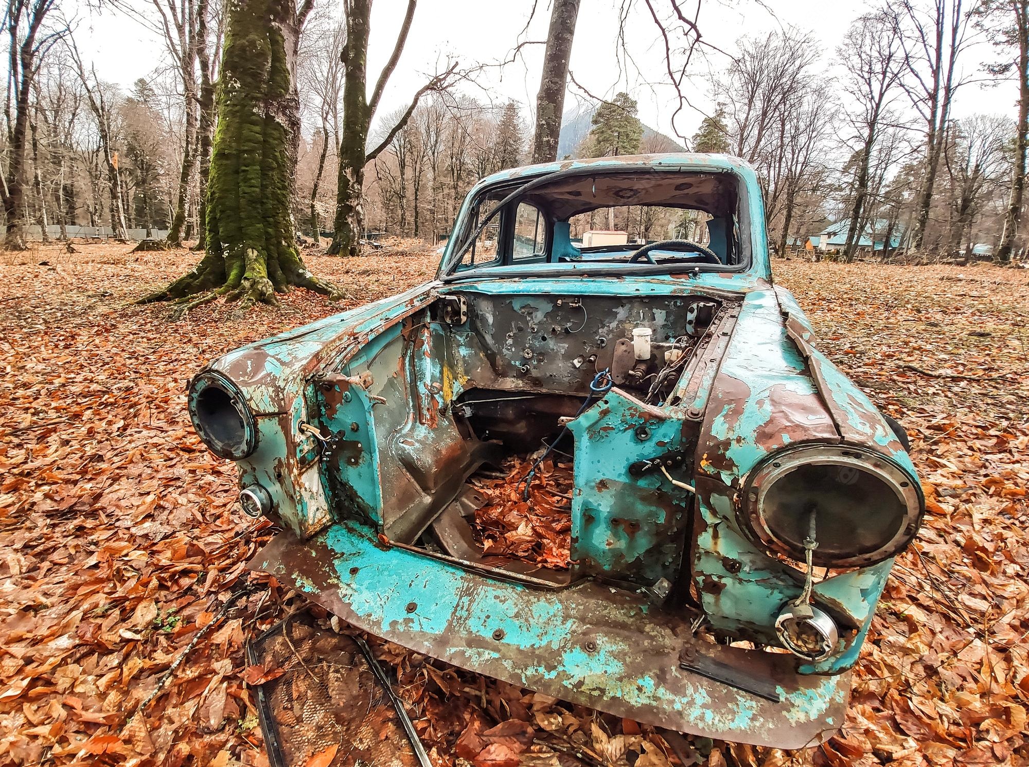 Premium Photo. Old rusty car outdoors in autumn park