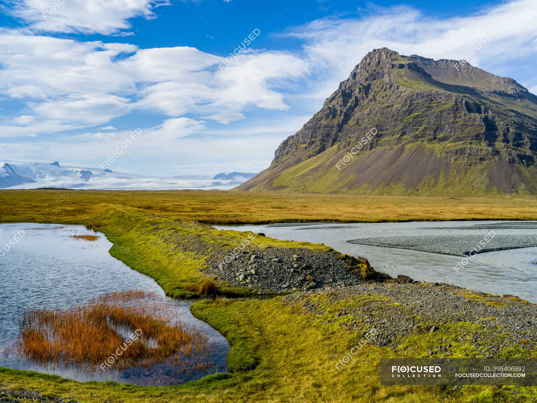 Rugged outcrop on tundra beside a fjord; Hornafjordur, Eastern Region, Iceland