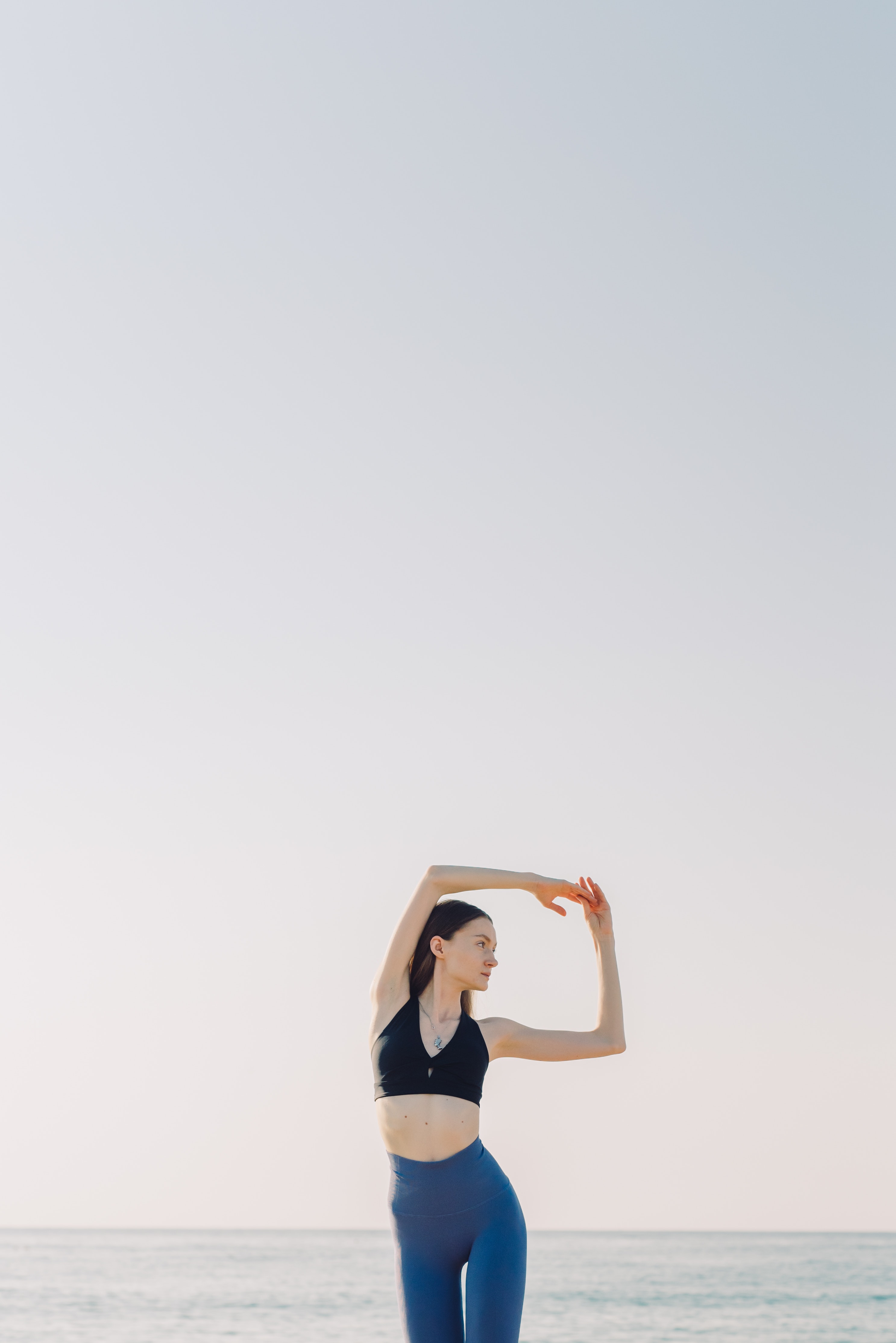 Woman Doing Yoga by the Beach · Free