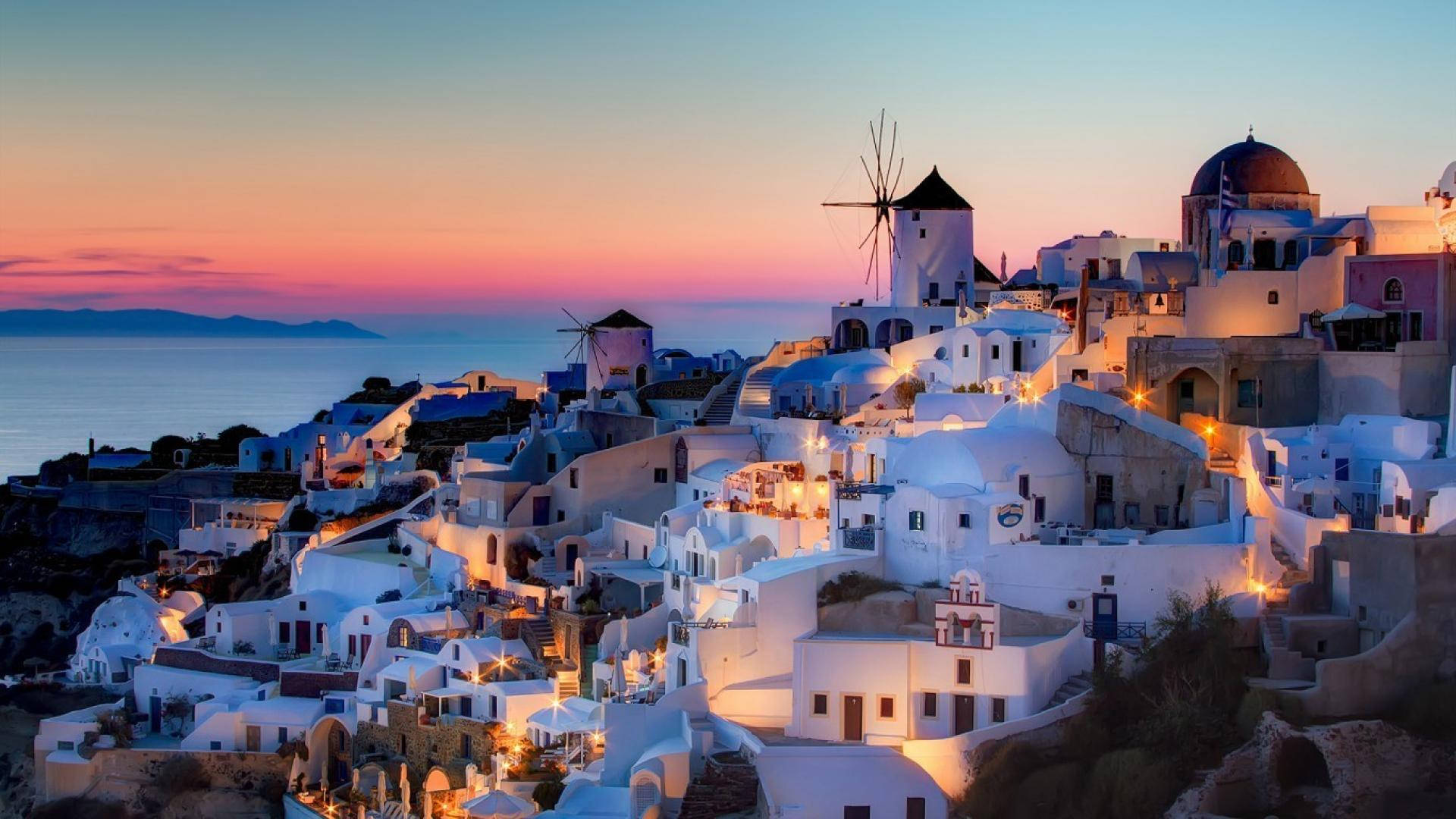 Download Santorini Houses In Greece Sunset Wallpaper