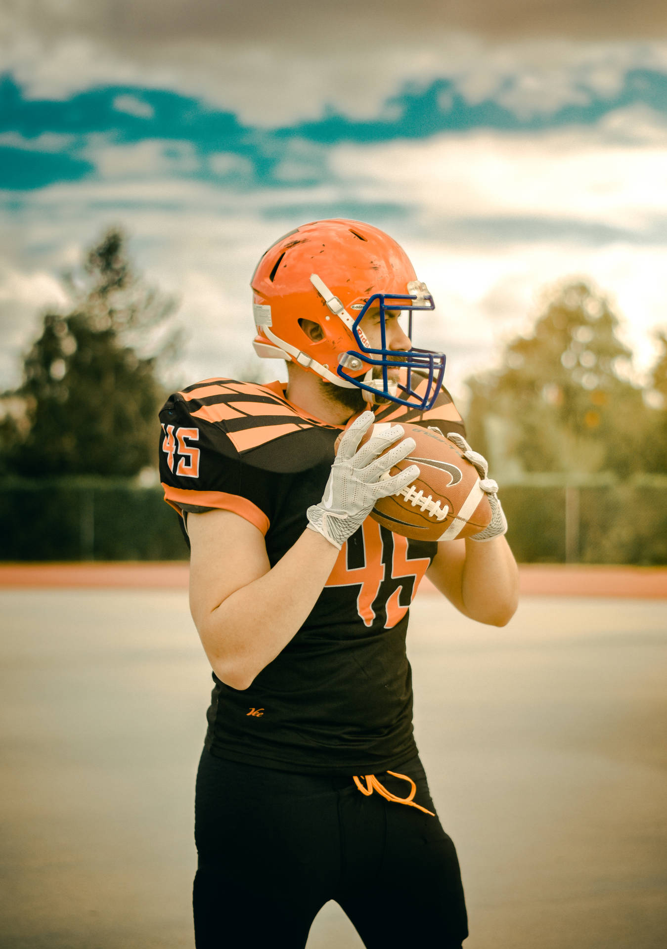 Download American Football Orange And Black Wallpaper