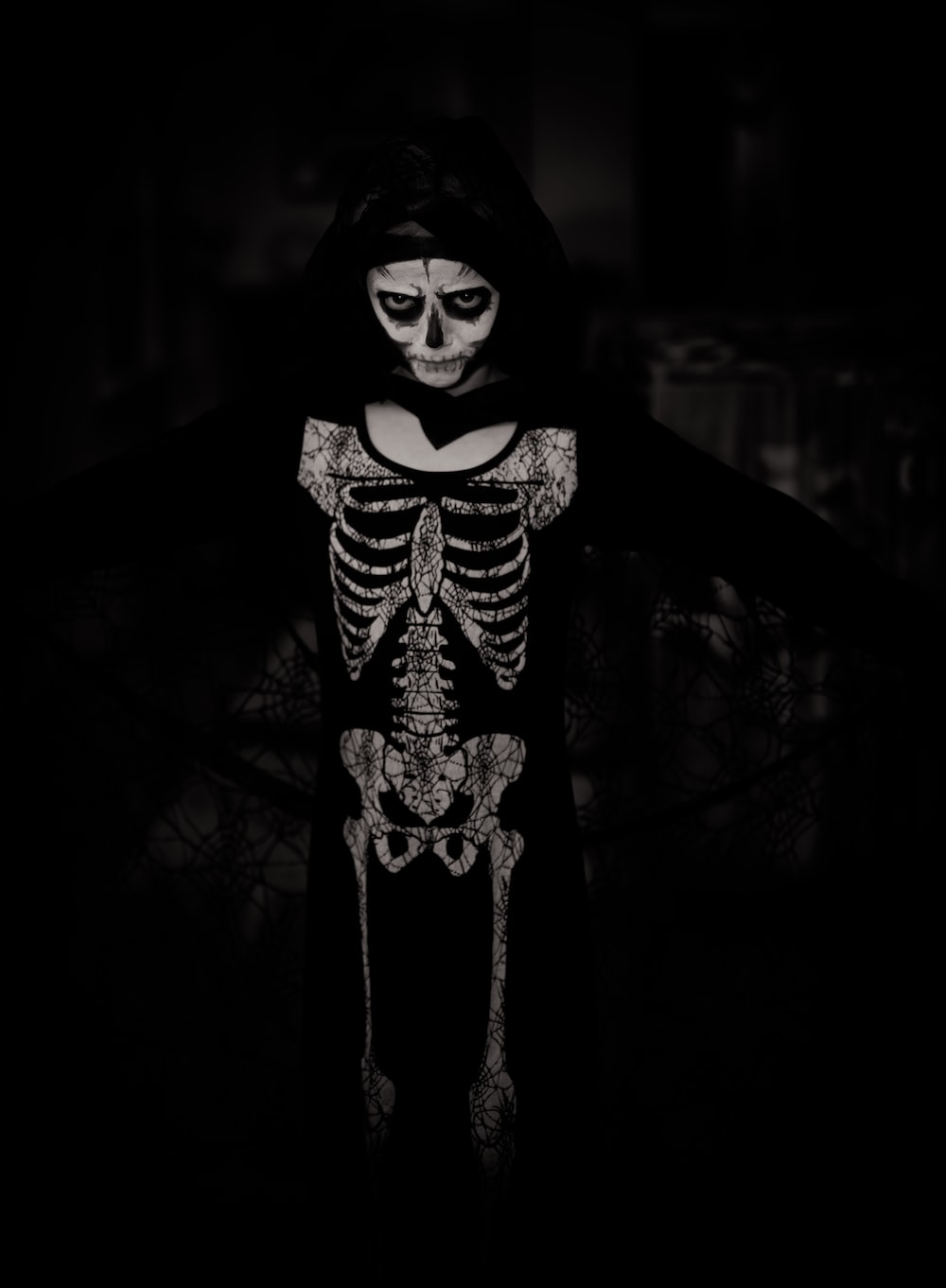 person wearing skeleton costume photo