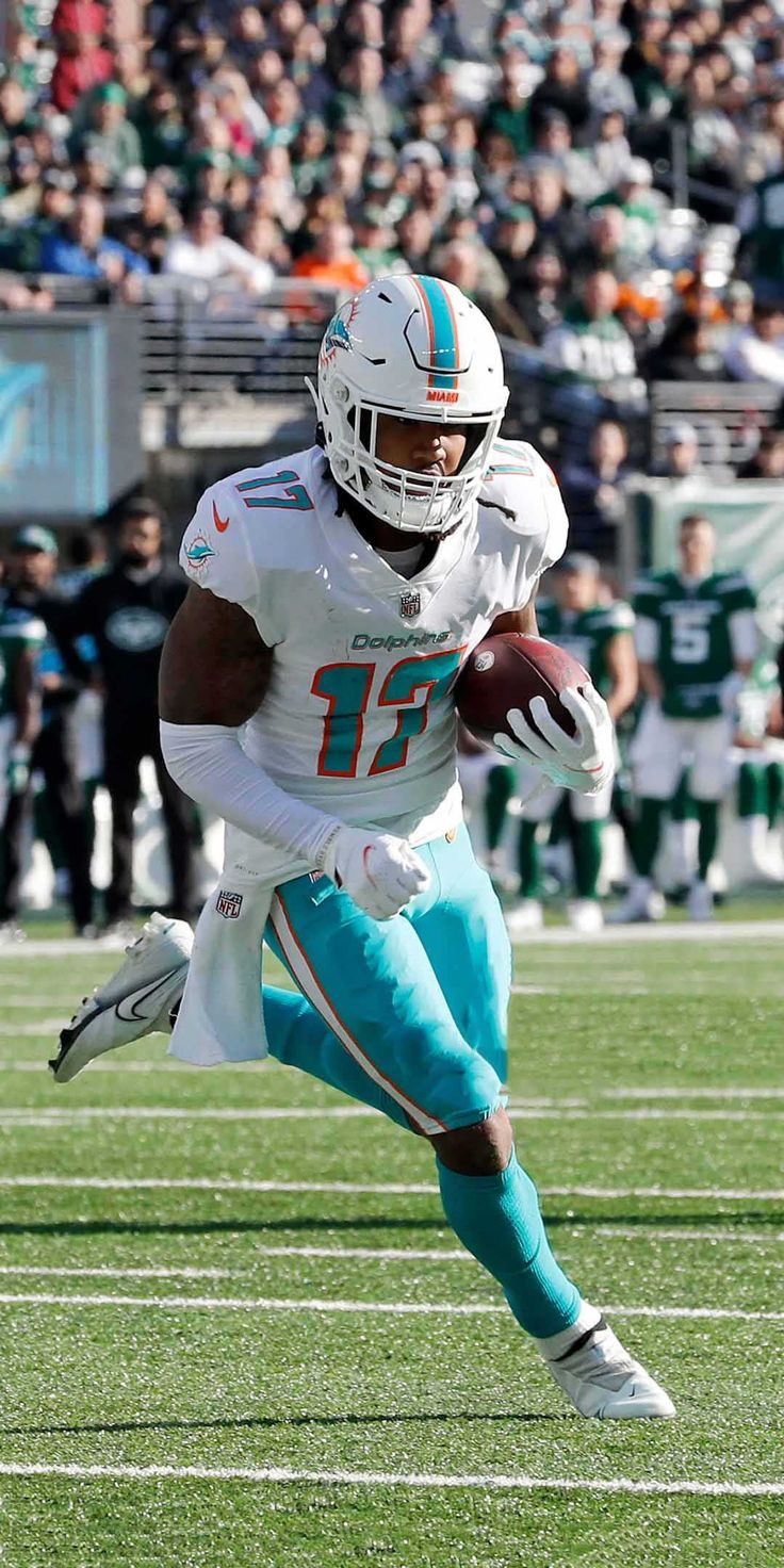 Jaylen Waddle Background Discover more American Football, Dolphins, Football, Jaylen Waddle, Miami Dolphin. Miami dolphins wallpaper, Miami dolphins, Nfl dolphins