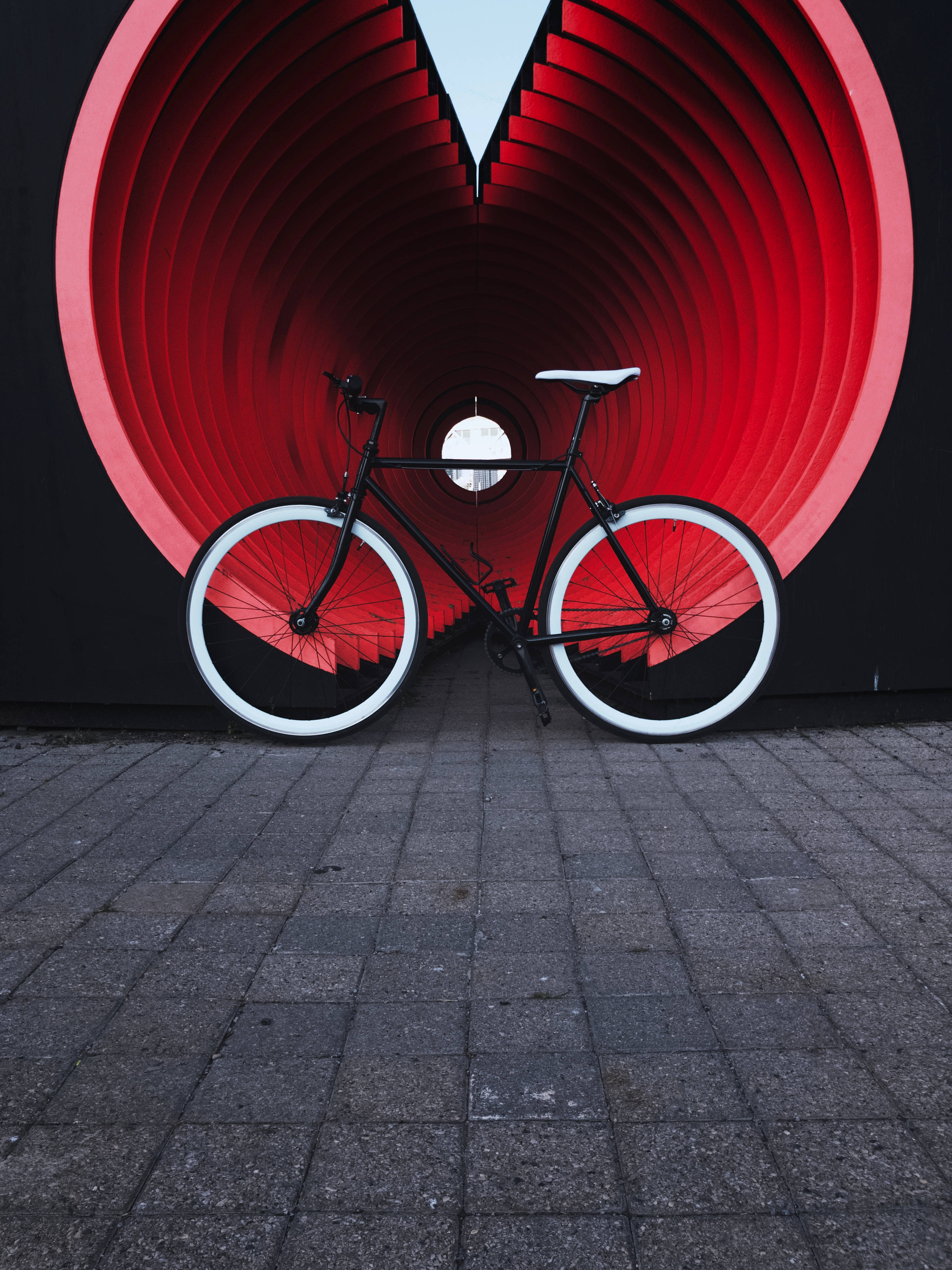 Download Aesthetic Bike And Red Tunnel Wallpaper