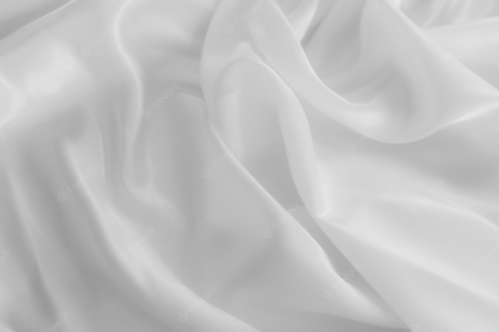 Premium Photo. White cloth background abstract with soft waves closeup texture of clothxa