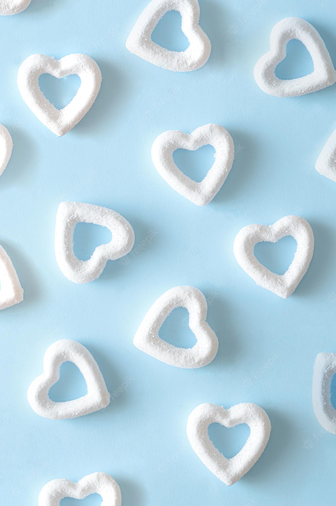 Premium Photo. White hearts on a blue background minimal aesthetic love valentines wallpaper