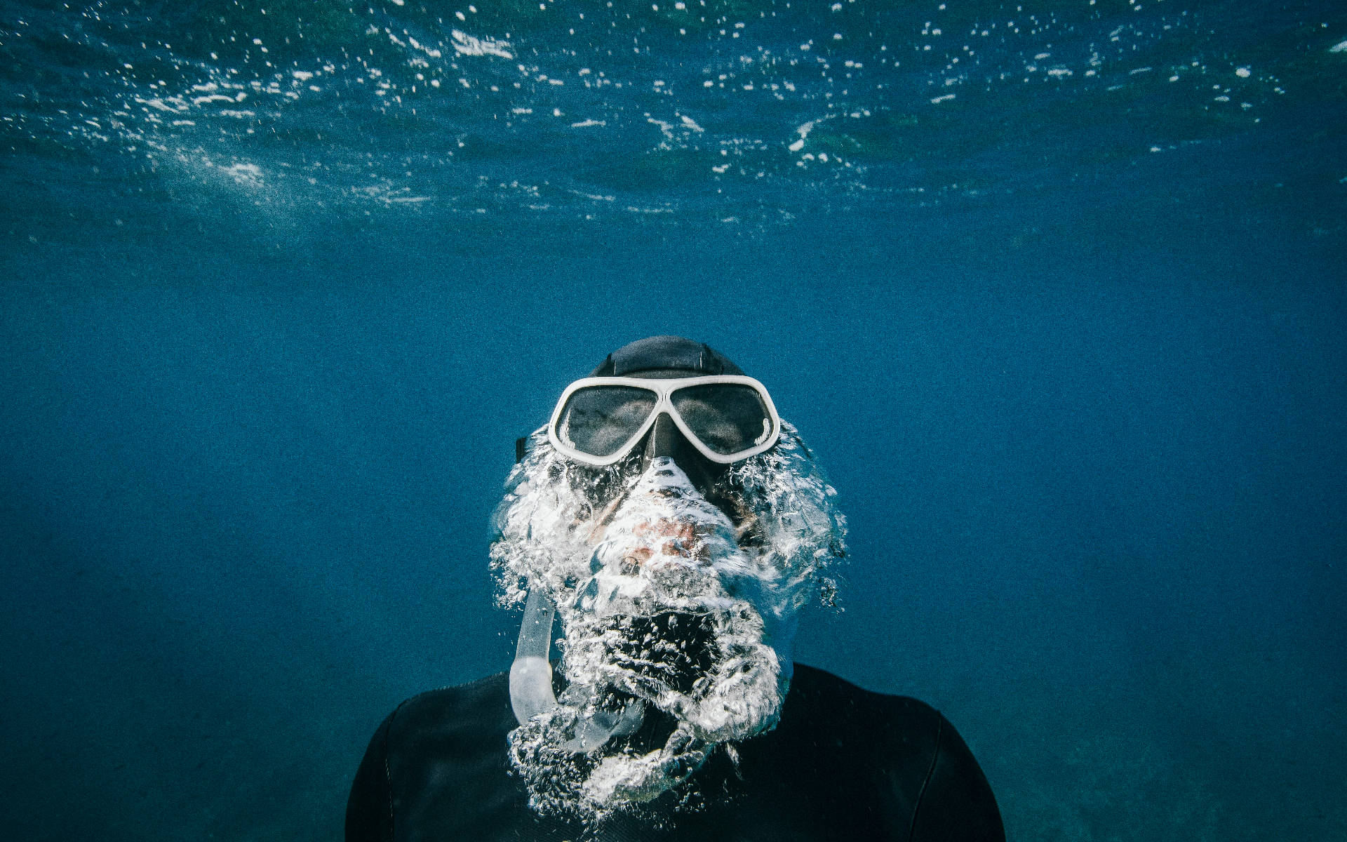 Download Scuba Diver Swimming Upward Wallpaper