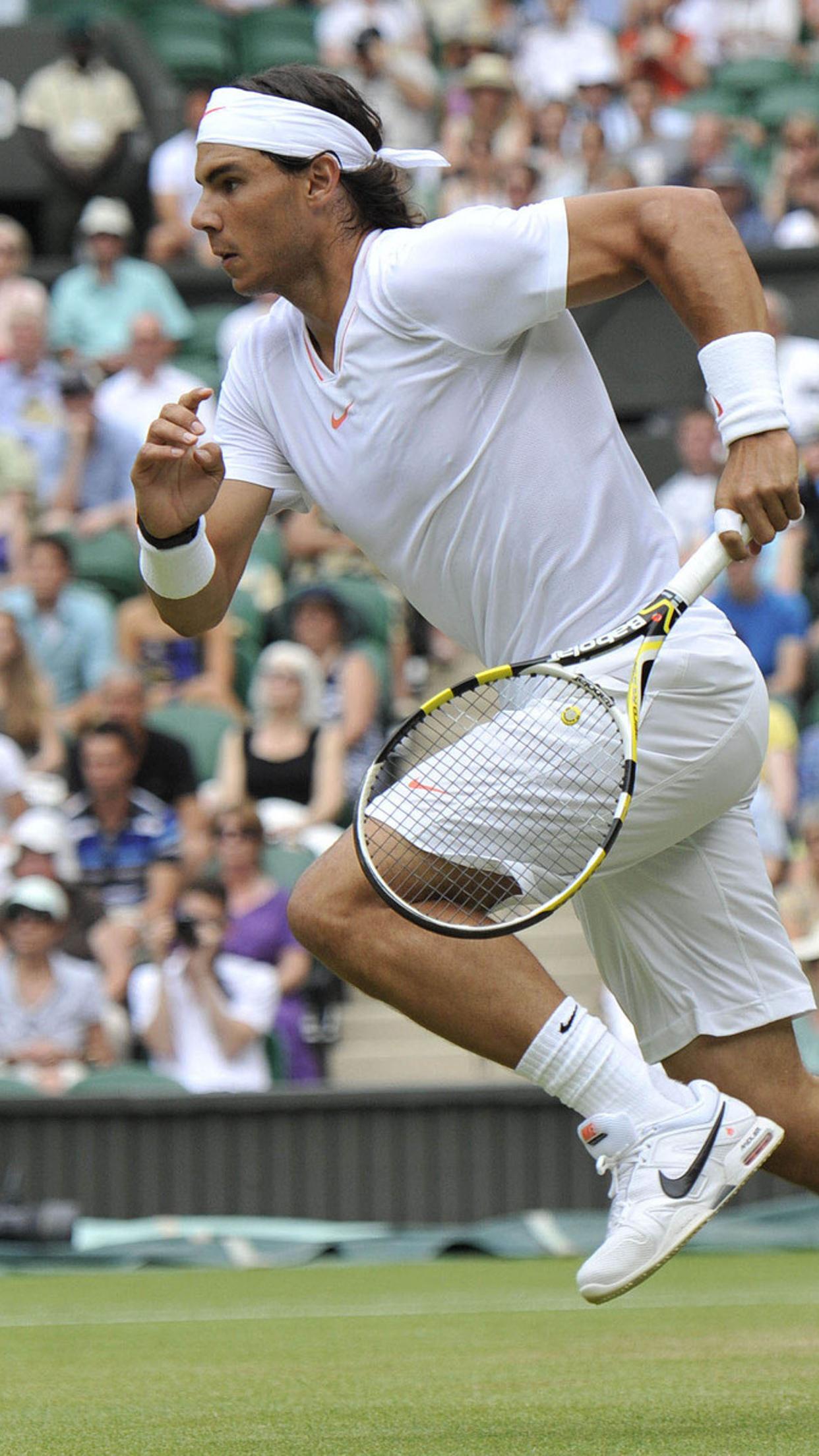 Rafael Nadal in the middle of the game of tennis