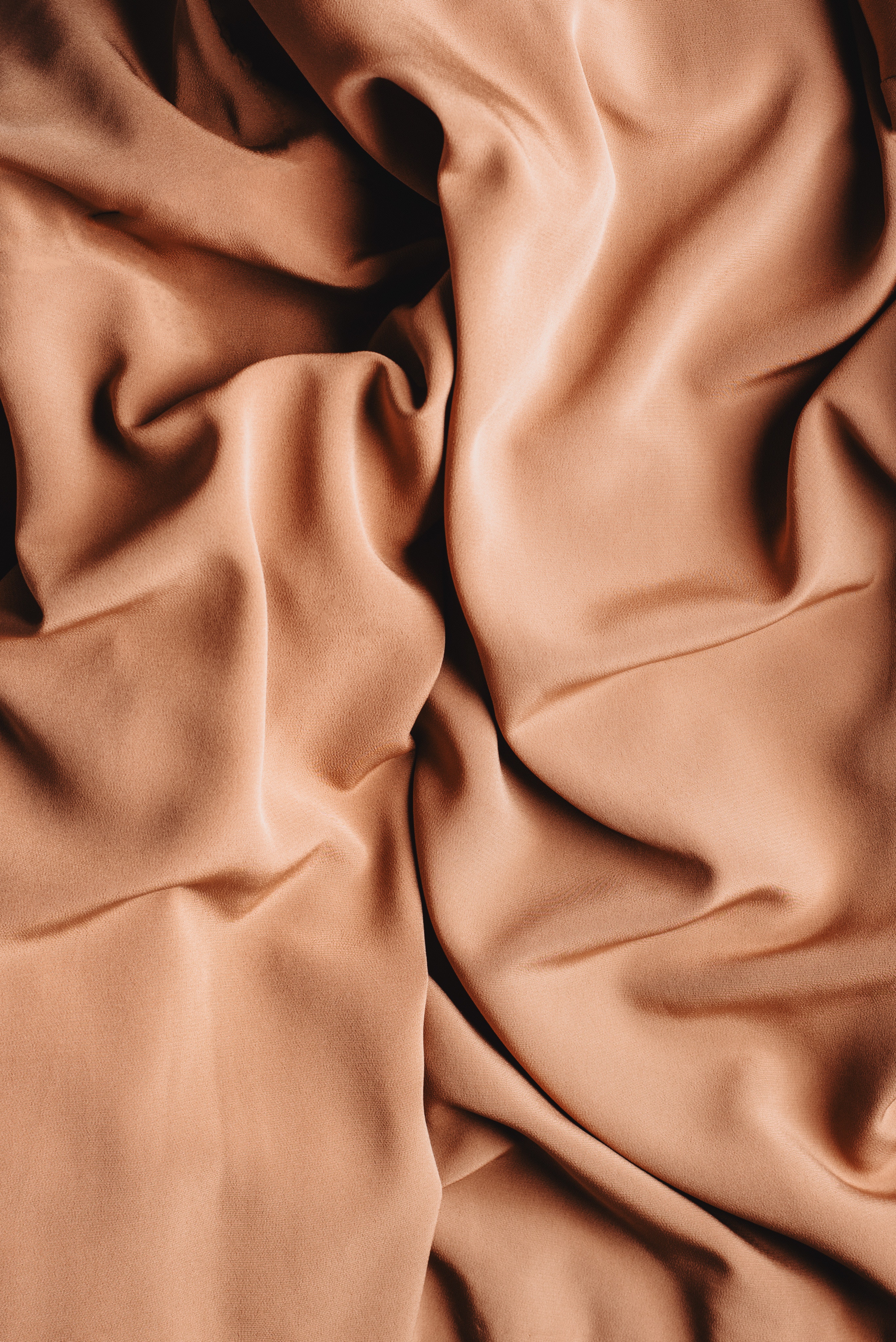 Textured backdrop of crumpled textile with smooth surface · Free
