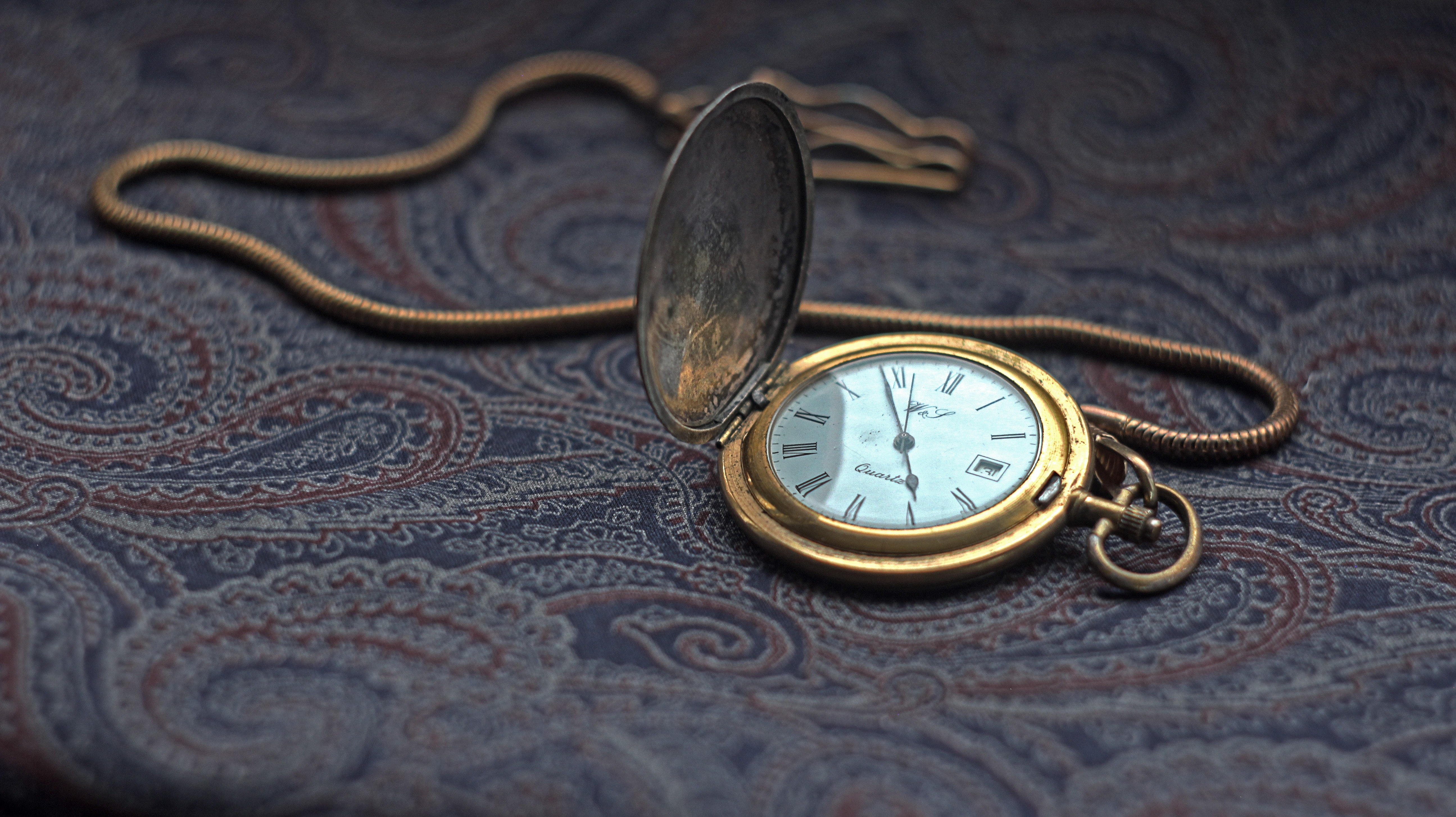 Close Up Of Pocket Watch Gears Against Black Background · Free