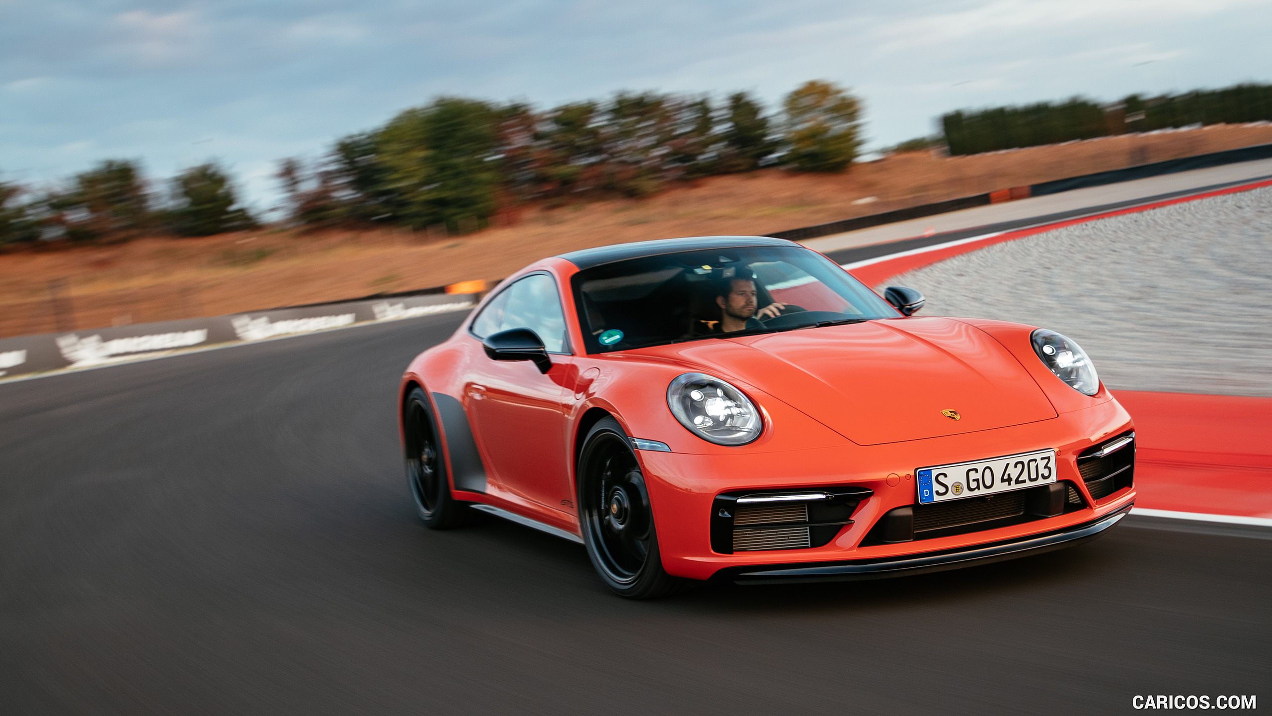 2022 Porsche 911 Carrera 4 GTS (Color: Lava Orange) Three Quarter