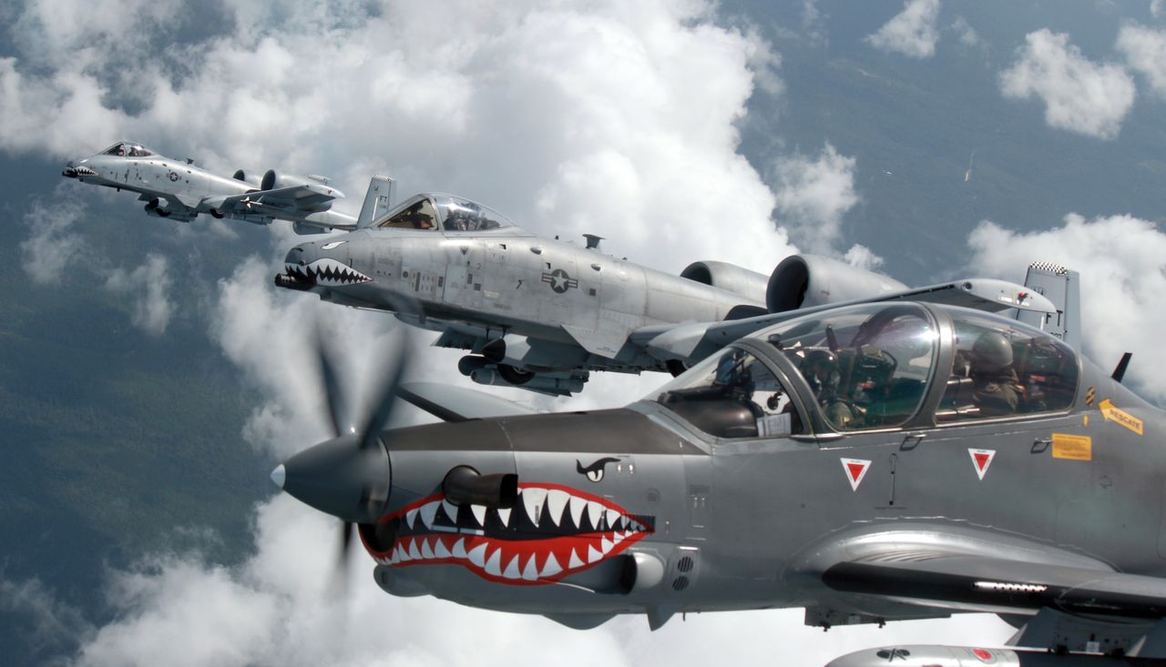 Sharkmouths! U.S. A 10 Warthogs And Colombian Air Force A 29B Super Tucanos Fly Together