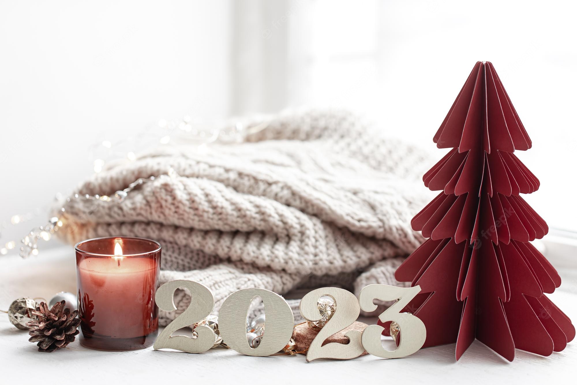 Free Photo. Christmas background with decorative numbers 2023 and cozy details