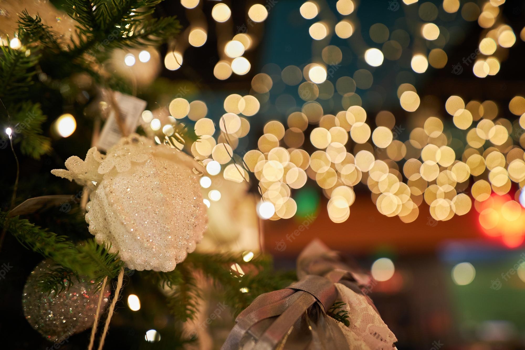 Premium Photo. New year's decorations 2023 new year's decorative decorations on the christmas tree closeup