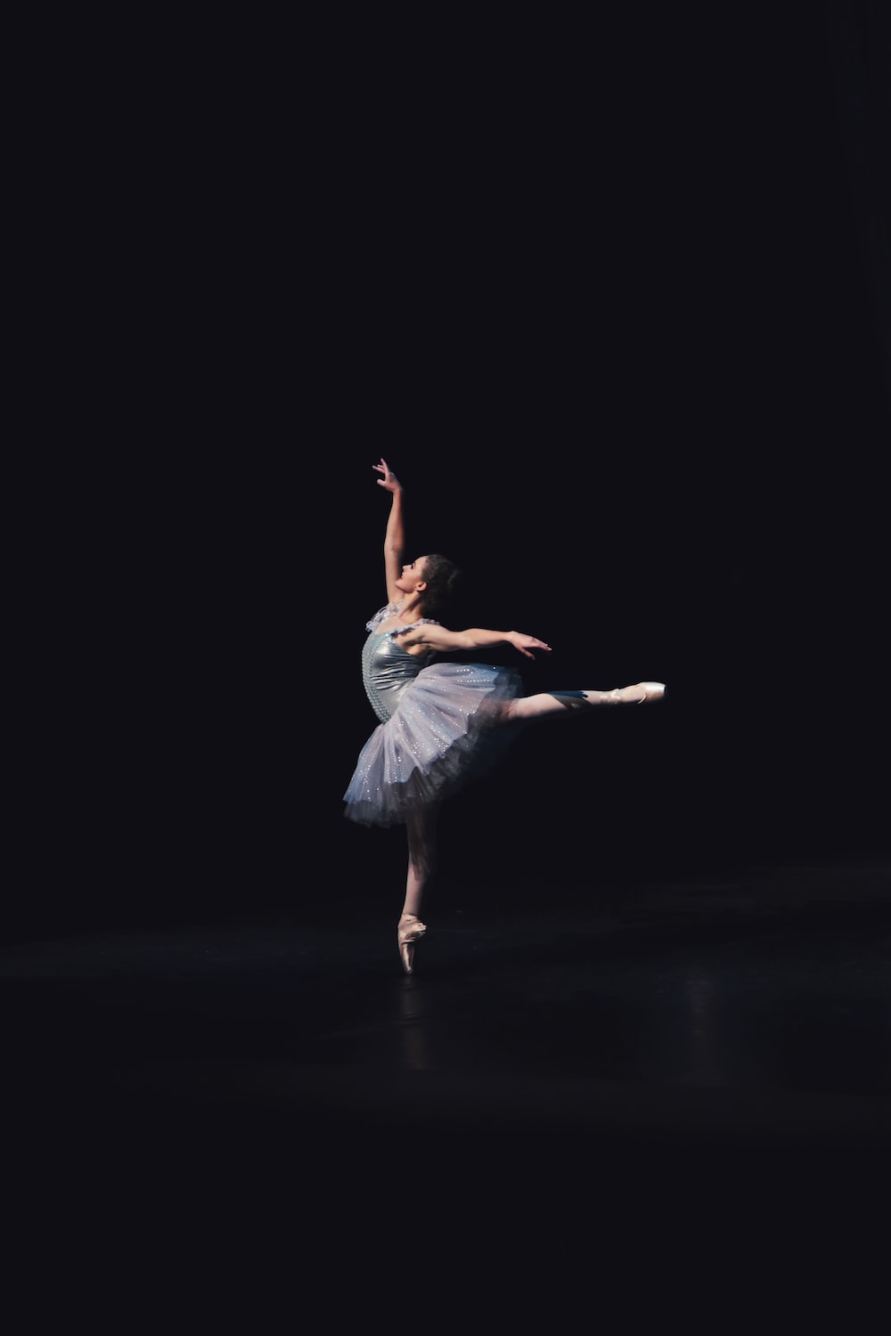 photography of dancing ballerina photo