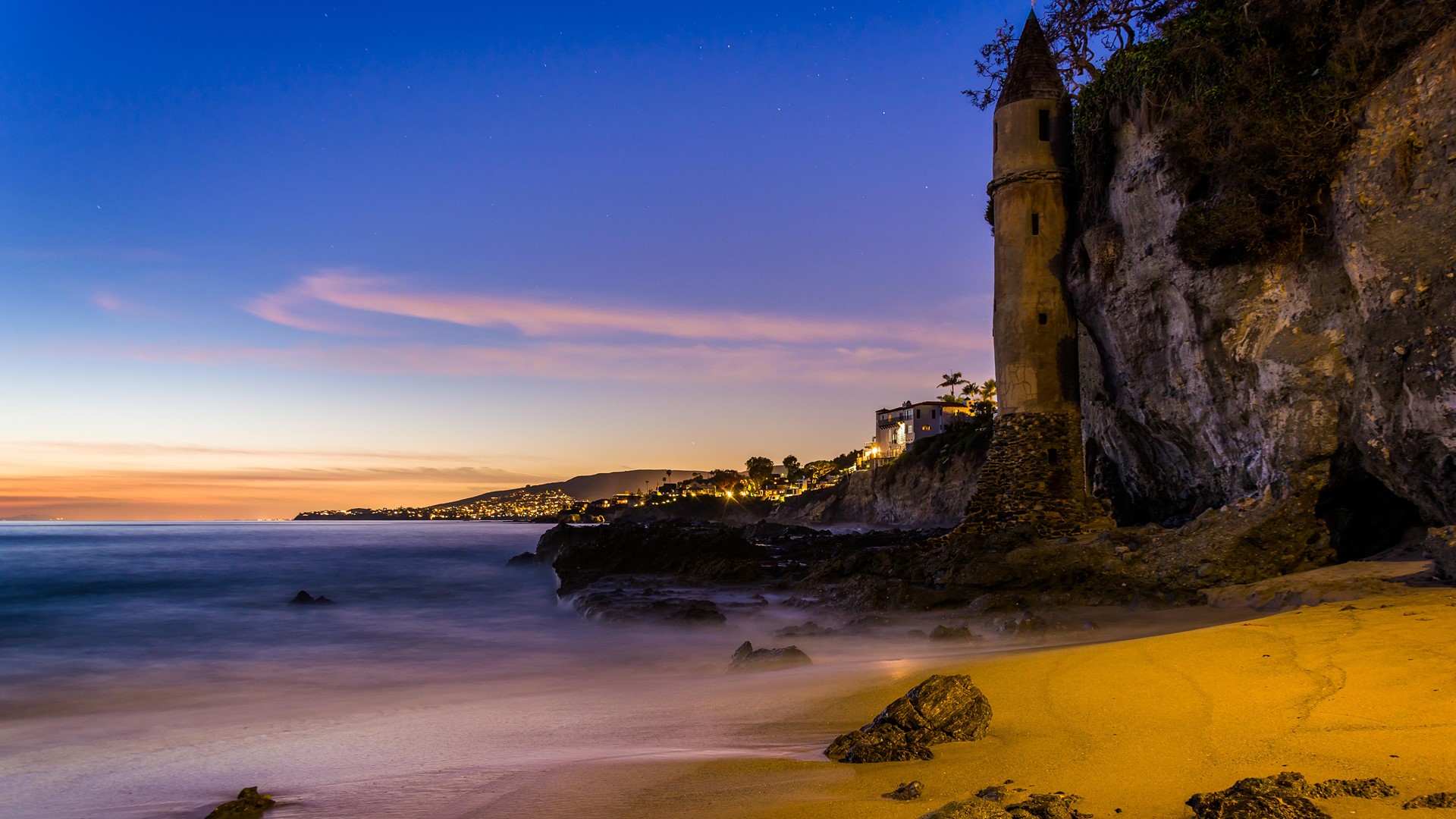 Victoria Beach Tower at sunset, Laguna Beach, California, USA. Windows 10 Spotlight Image